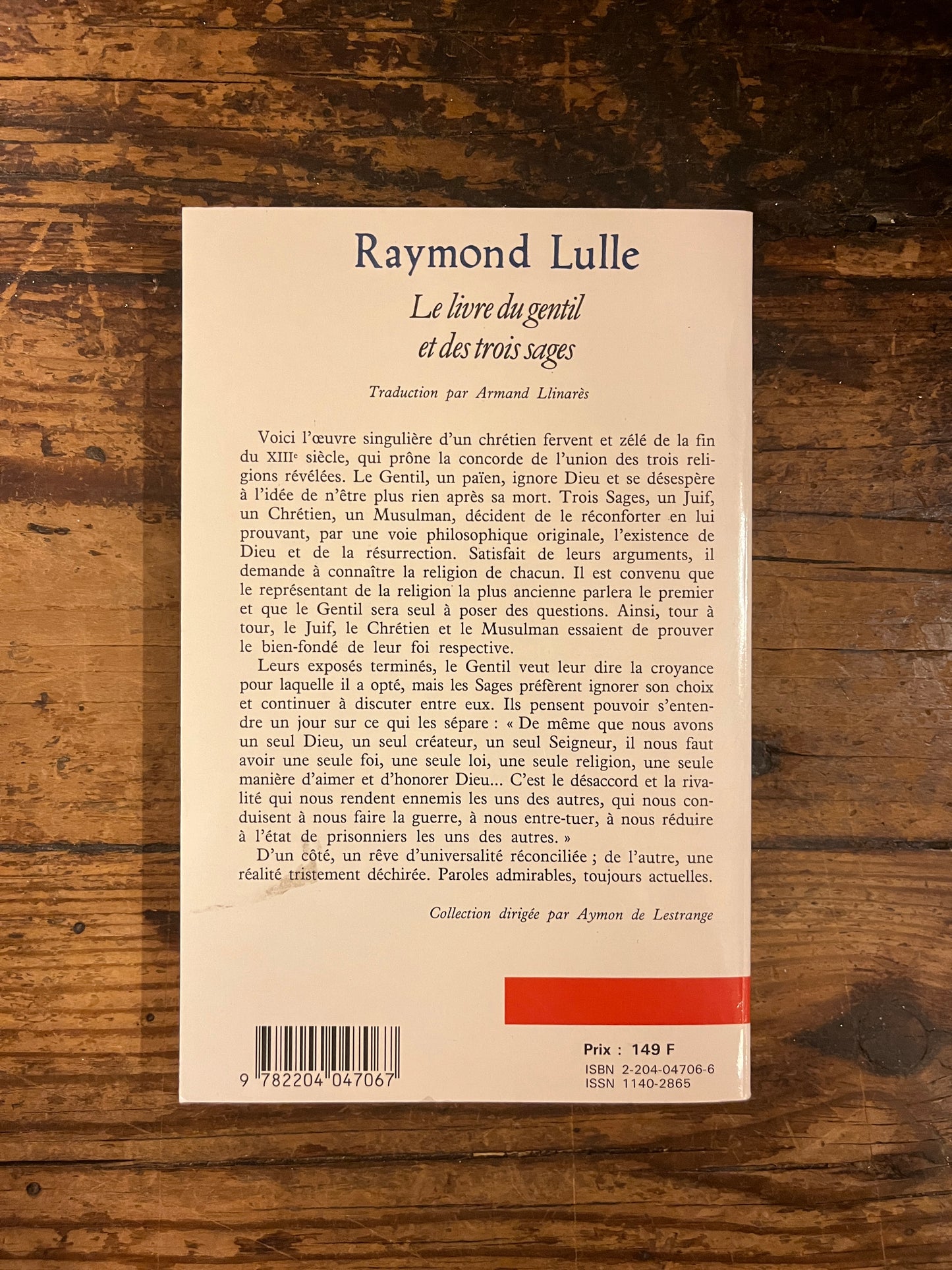 quatrième de couverture du livre "le livre du gentil et des trois sages" sur fond de bois