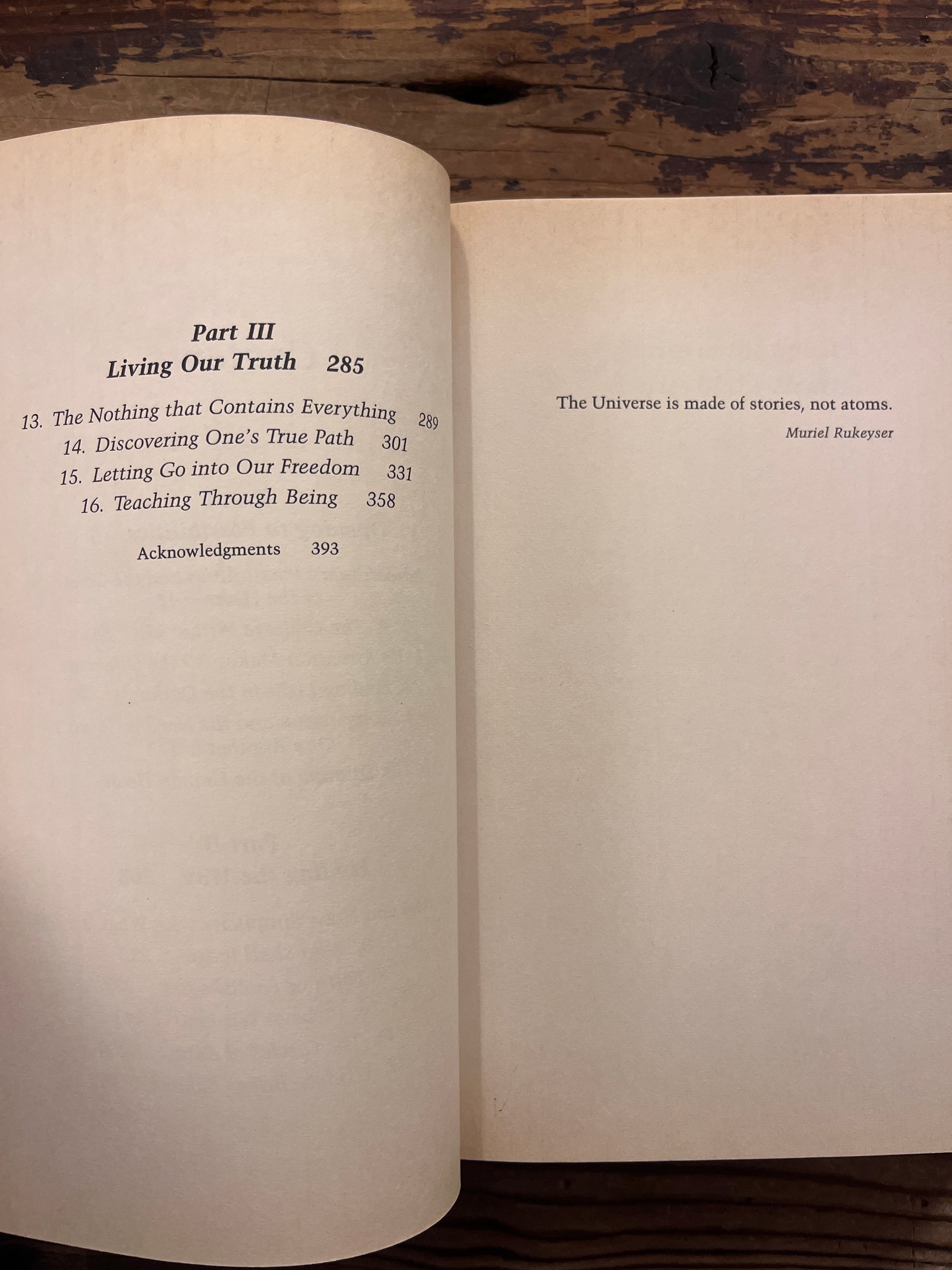 Book titled 'Stories of the Spirit, Stories of the Heart' on a wooden surface