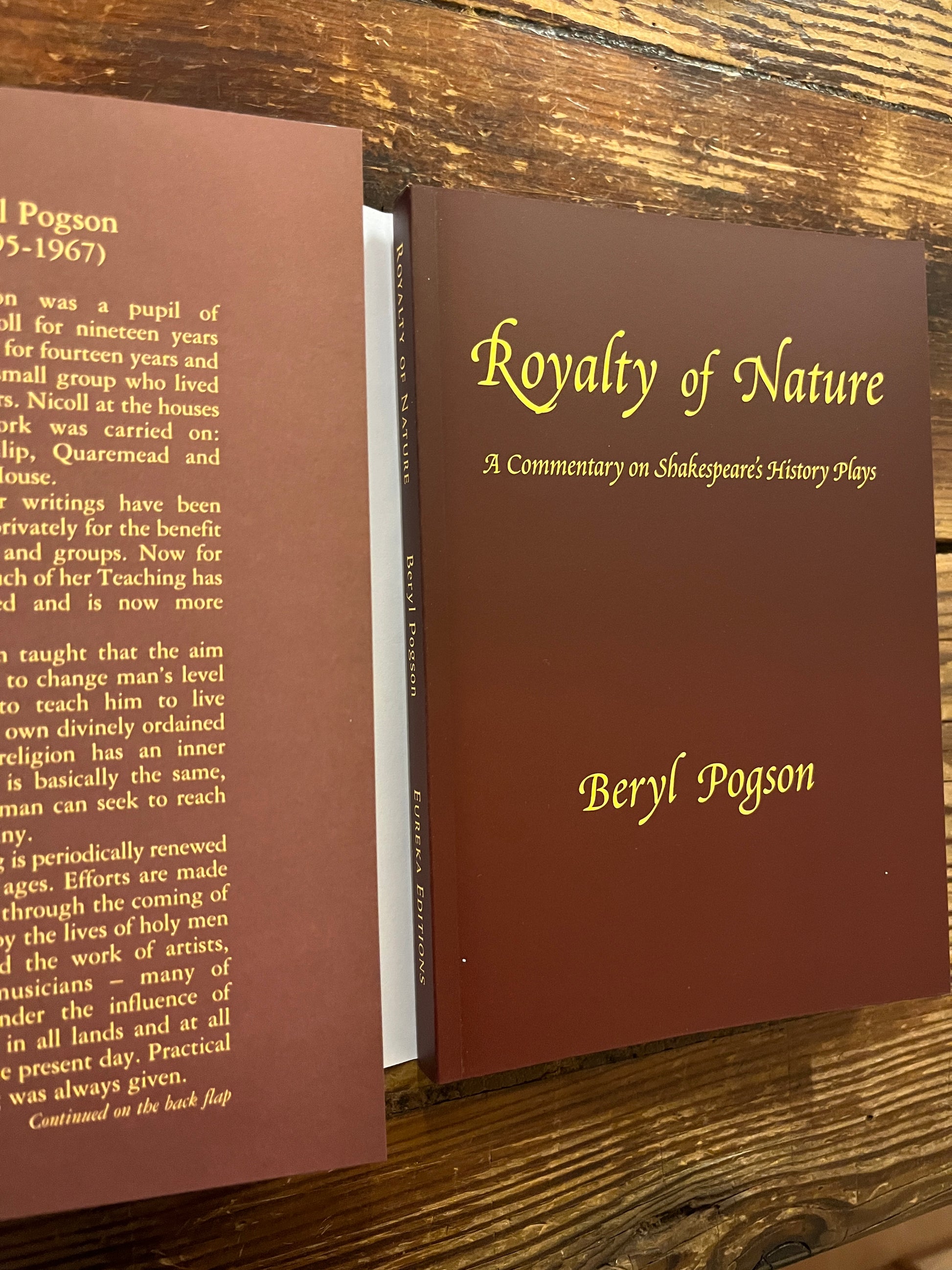 Book titled 'Royalty of Nature' by Beryl Pogson on a wooden surface