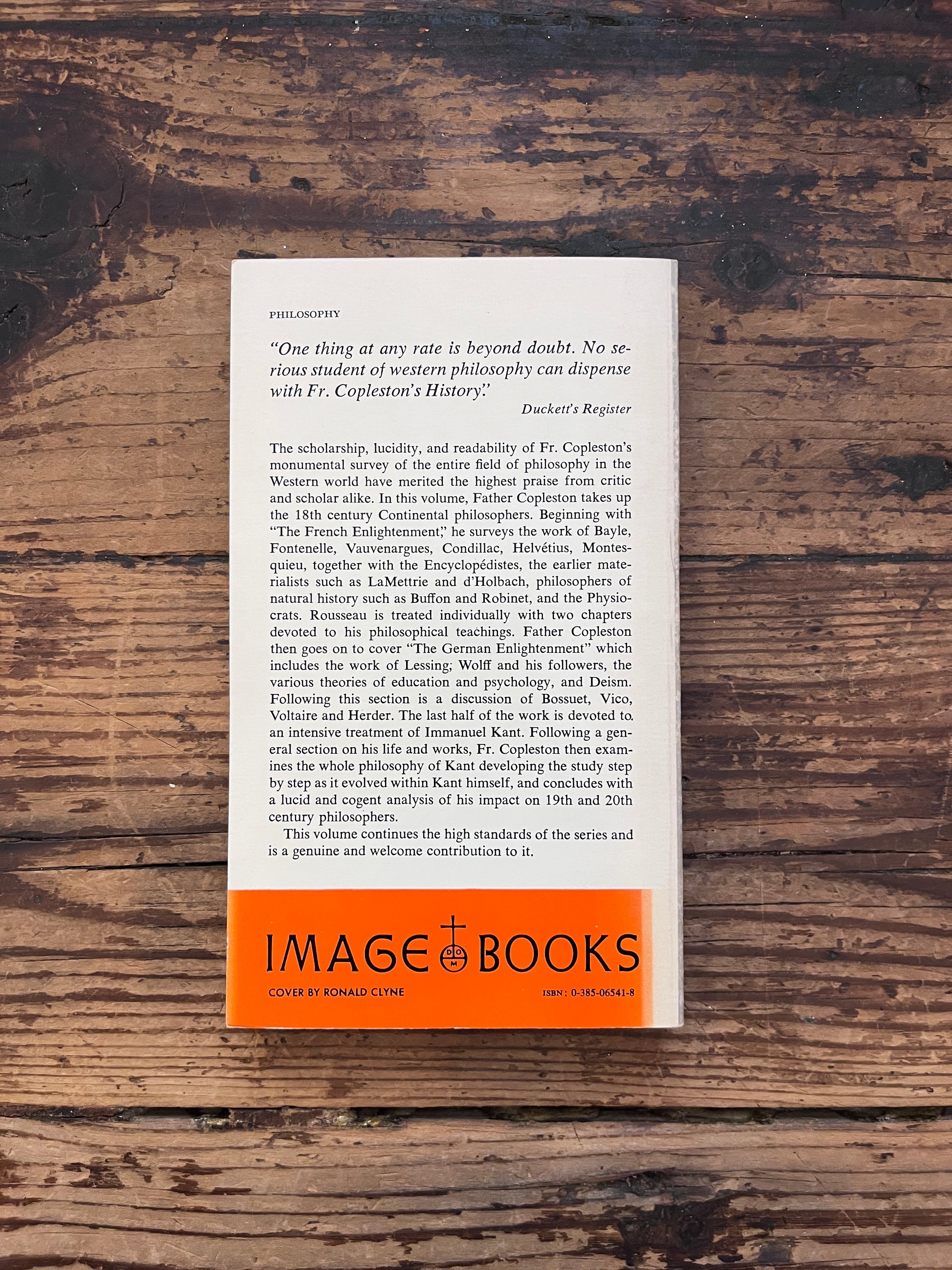 photo of the cover of the book " a history of philosophy" on a wooden background