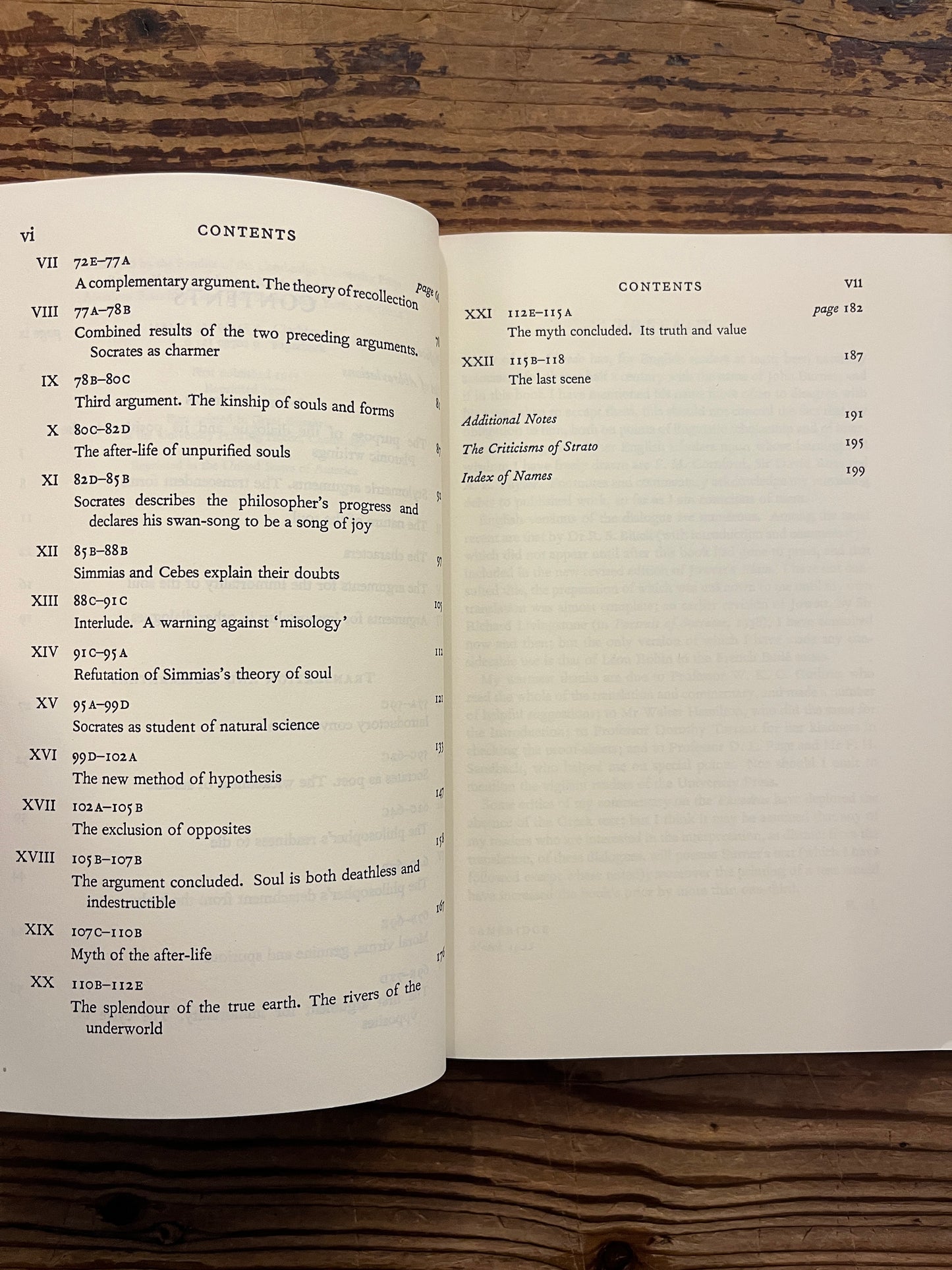 Open book titled 'Plato's Phaedo' translated with an introduction and commentary by R. Hackforth on a wooden surface