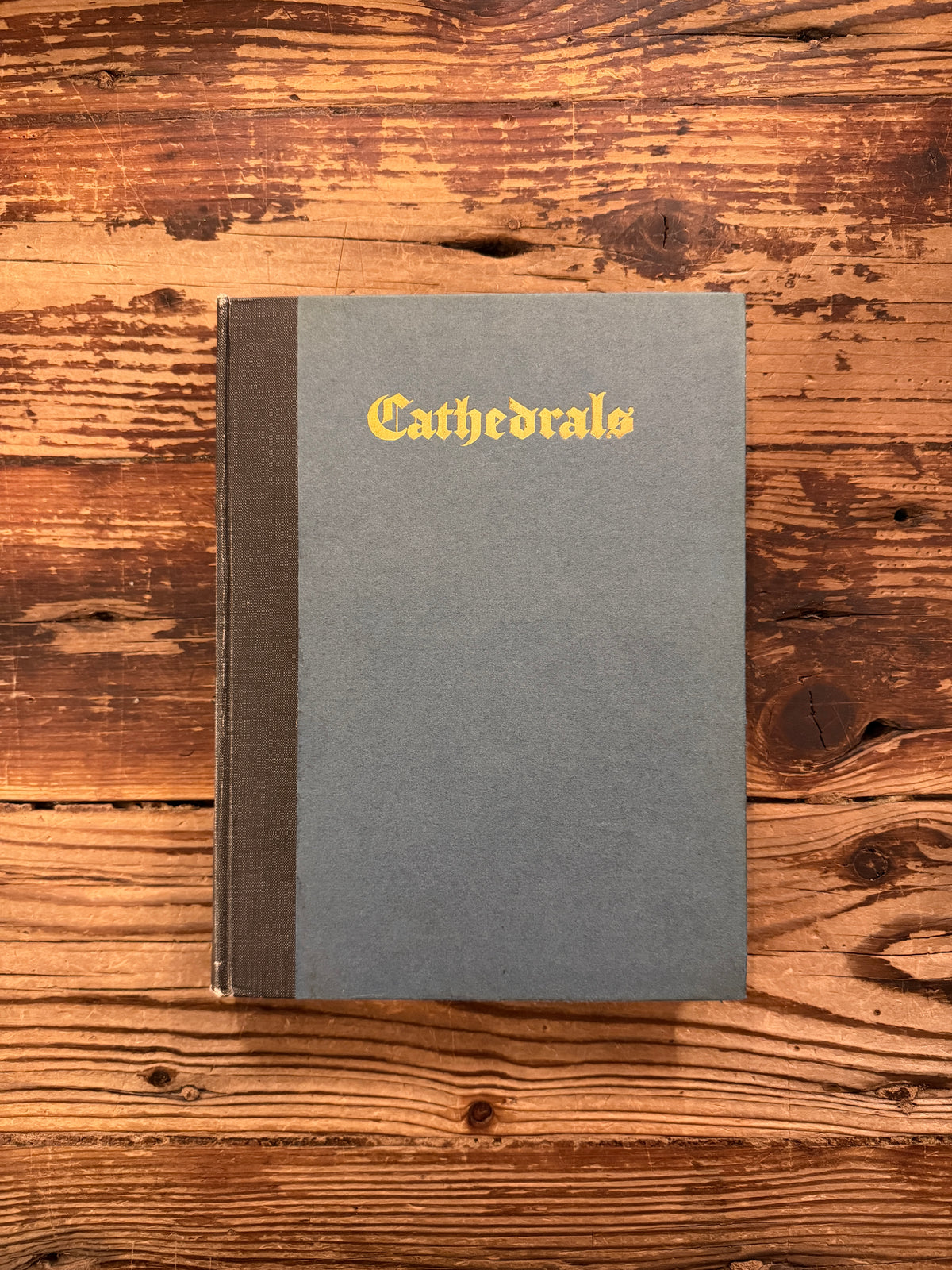 Front cover of a book titled 'Cathedrals' from 1926 from the series made by 'The Great Western Railway' on a wooden surface
