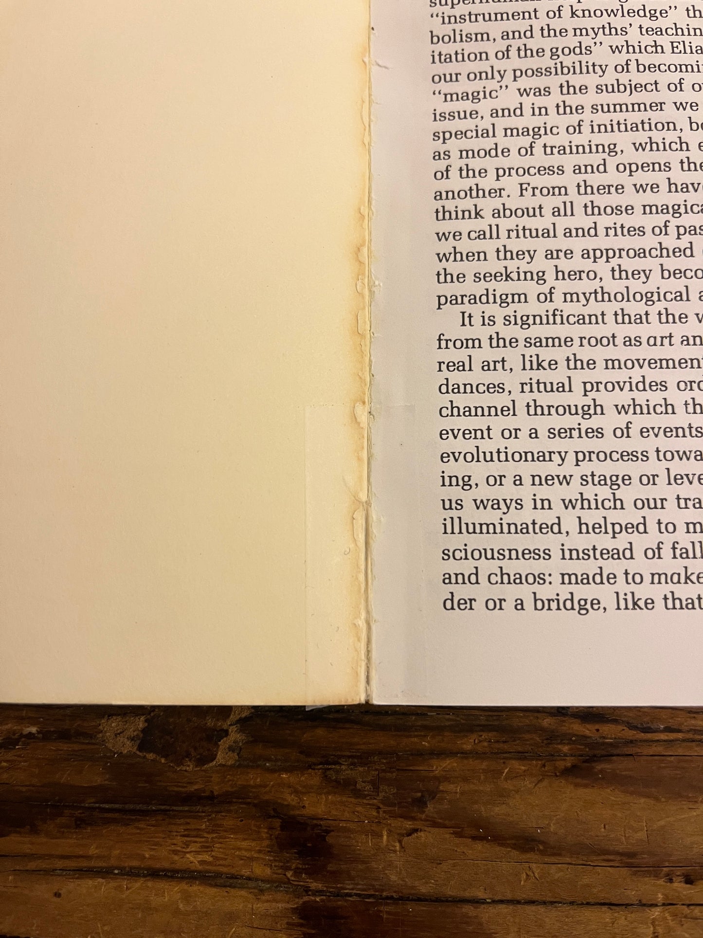 Open magazine titled 'Parabola' on a wooden surface showing tape 