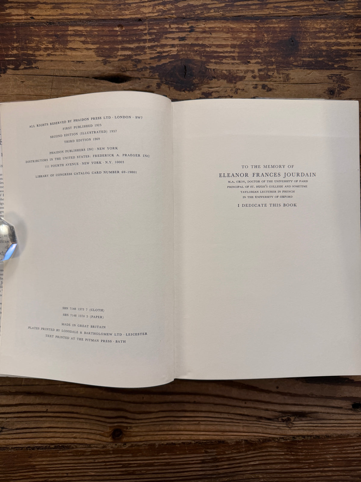 Open book titled 'Life in Medieval France' by Joan Evans, on a wooden surface