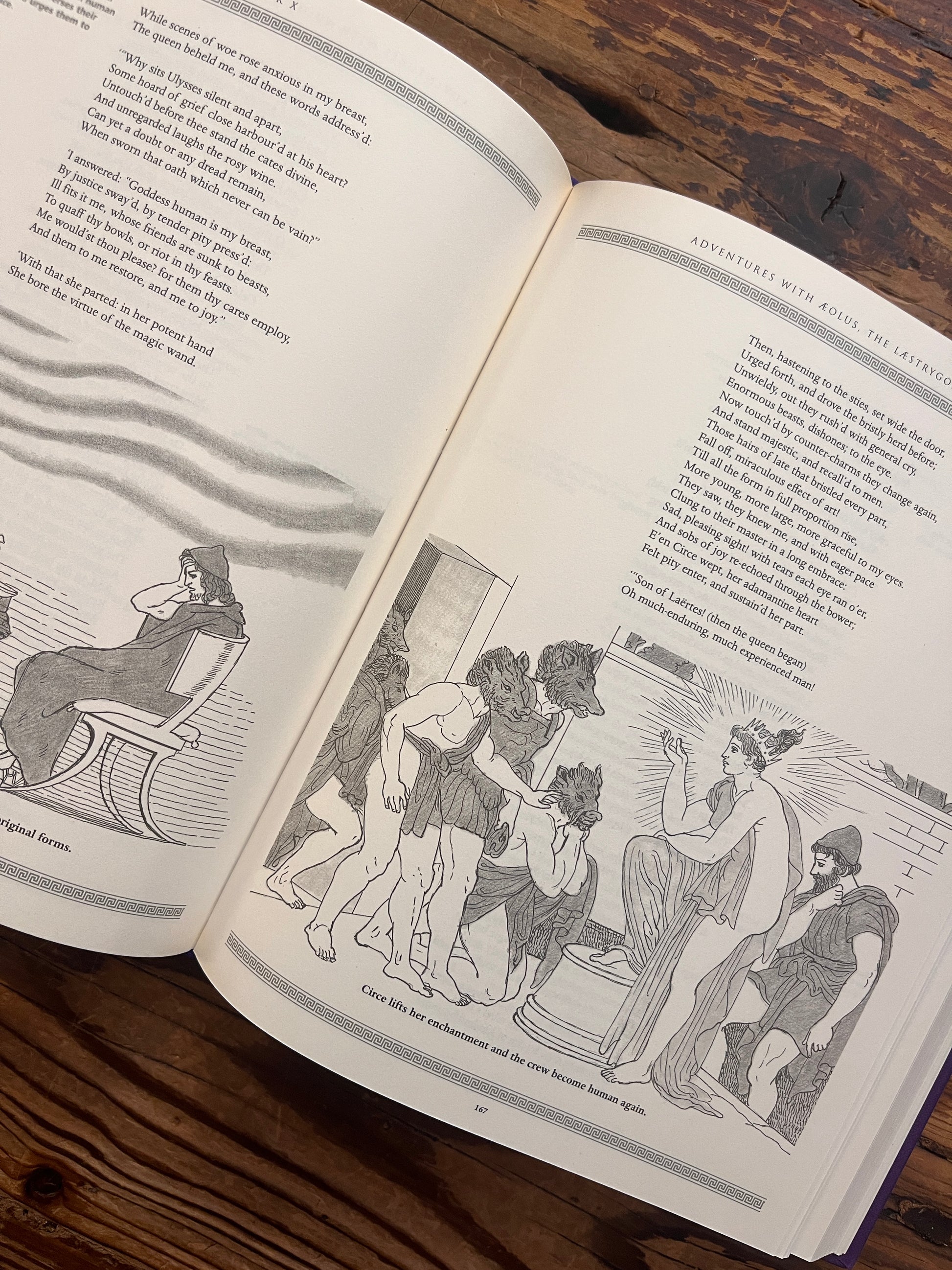 Open book titled 'The Odyssey' by Homer and translated by A. Pope on a wooden surface