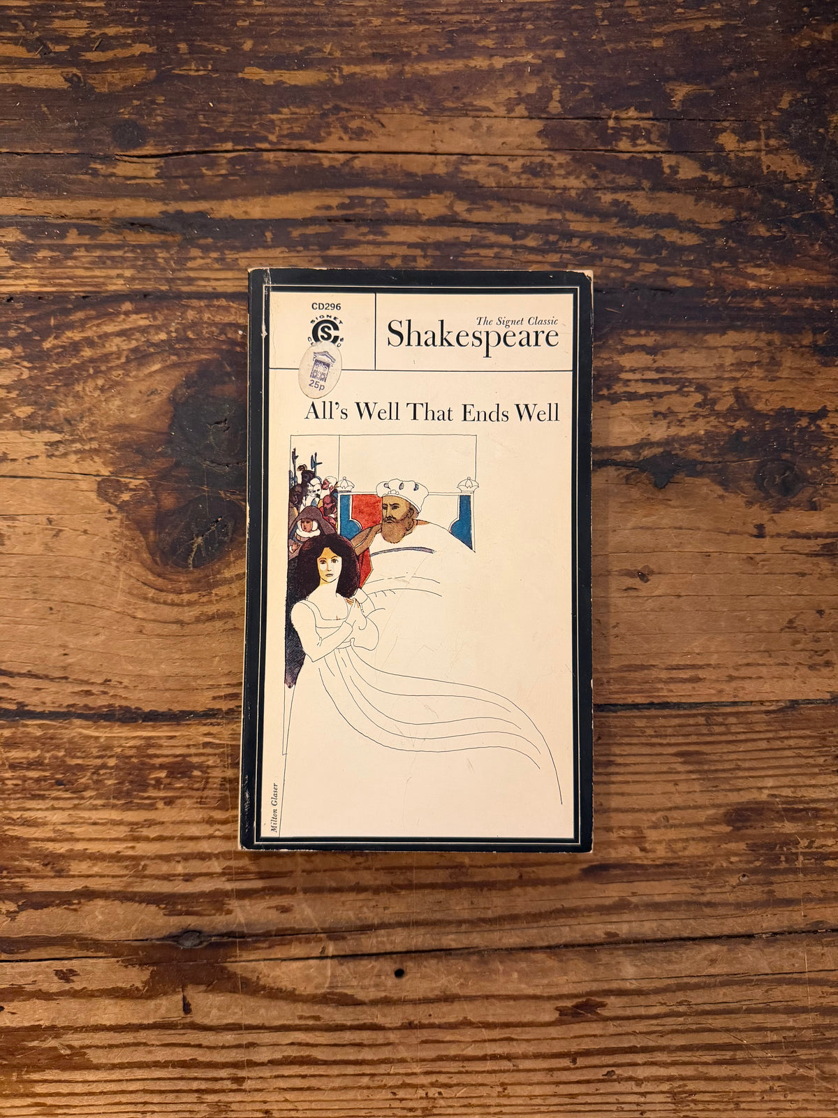 photo of the cover of the book "All's well that ends well" on a wooden background