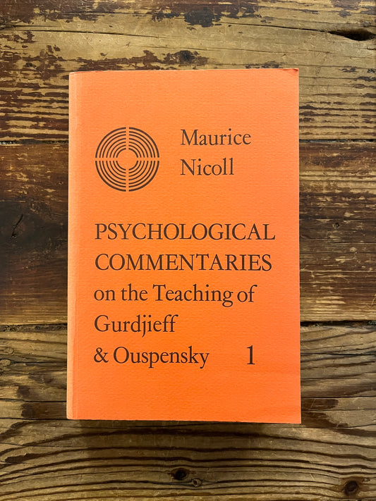 Book titled 'Psychological Commentaries on the Teaching of Gurdjieff & Ouspensky' by Maurice Nicoll on a wooden surface
