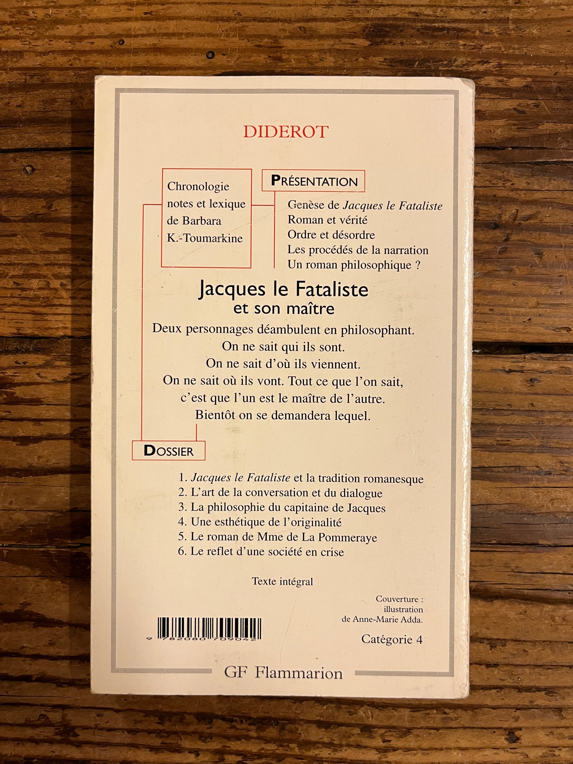 quatrième de couverture du livre "jacques le fataliste et son maitre" sur fond de bois