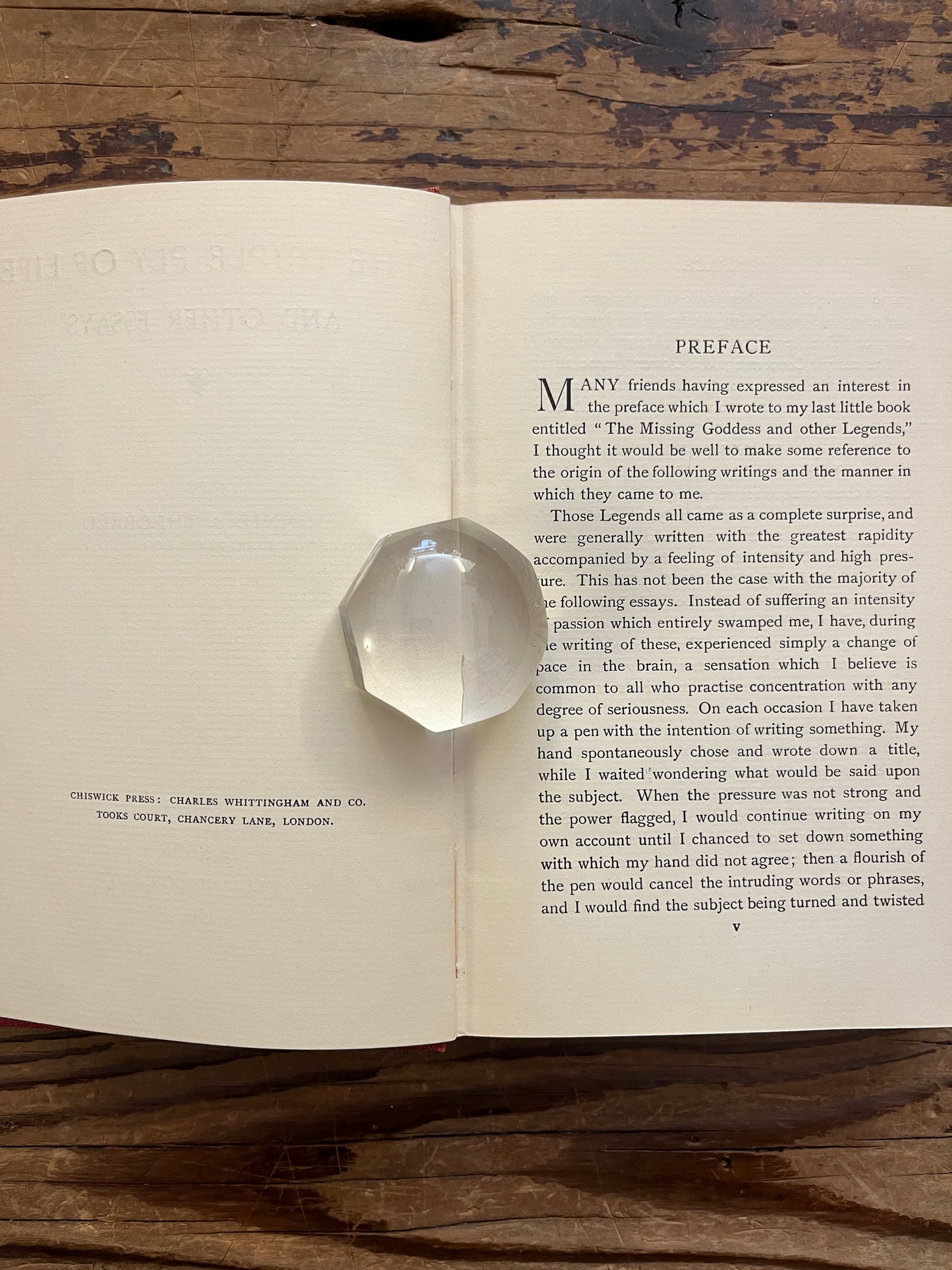 Open book titled 'The Triple Ply of Life' by Minnie E. Theobald on a wooden surface