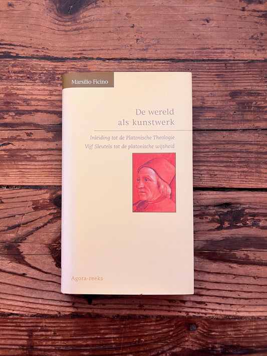 foto van de omslag van het boek "De wereld als kunstwerk" op houten achtergrond