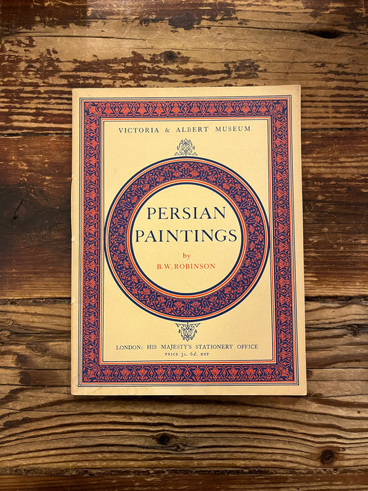 Book titled 'Persian Paintings' by A.W. Robinson on a wooden surface
