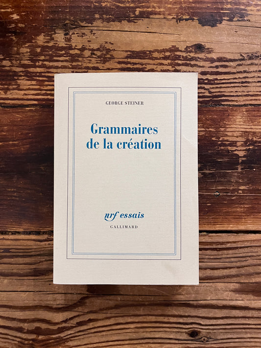 photo de la couverture du livre "grammaires de la creation"sur fond de bois