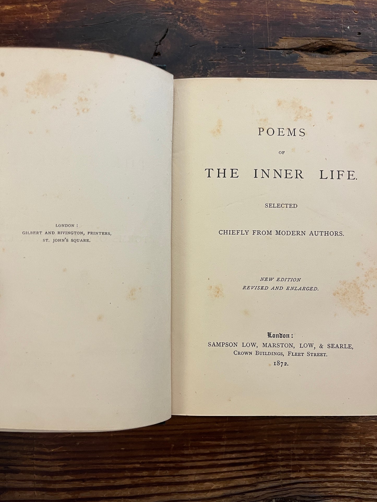Open book titled 'Poems of the Inner Life' on a wooden surface