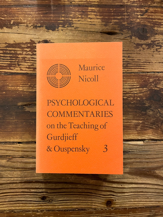Book titled 'Psychological Commentaries on the Teaching of Gurdjieff & Ouspensky, volume 3' by Maurice Nicoll on a wooden surface.