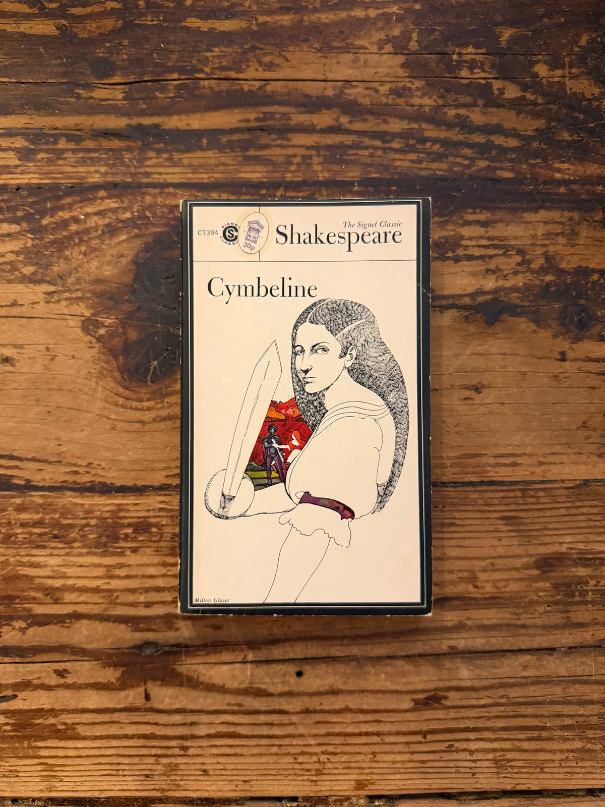photo of the cover of the book "Cymbeline" on a wooden background