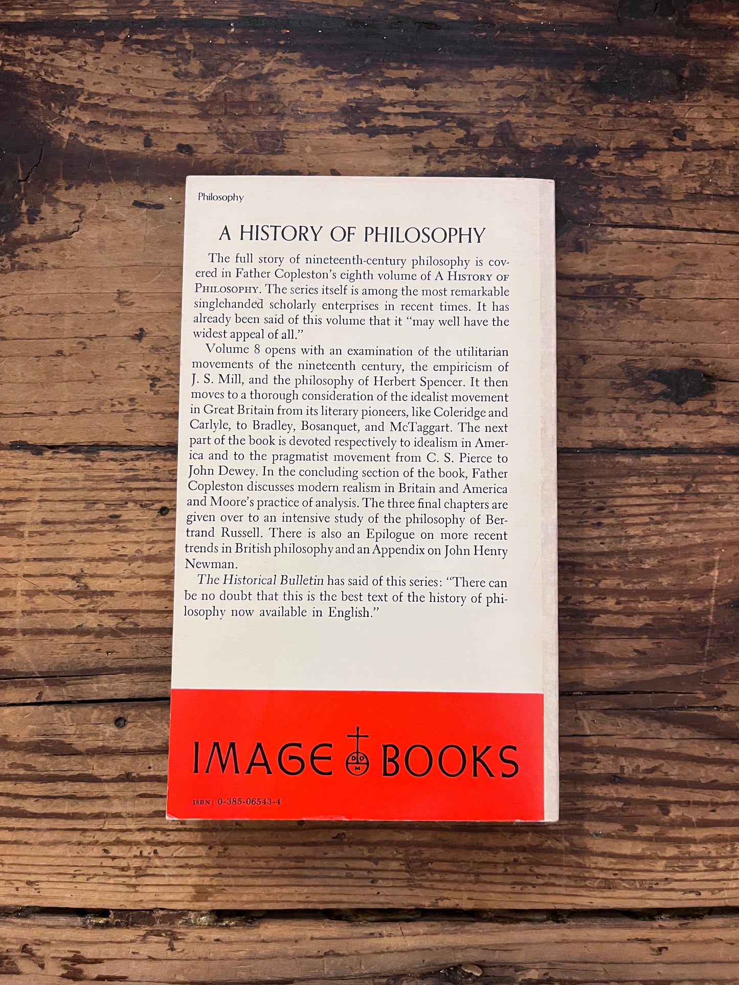 photo of the cover of the book " A history of philosophy" on a wooden background