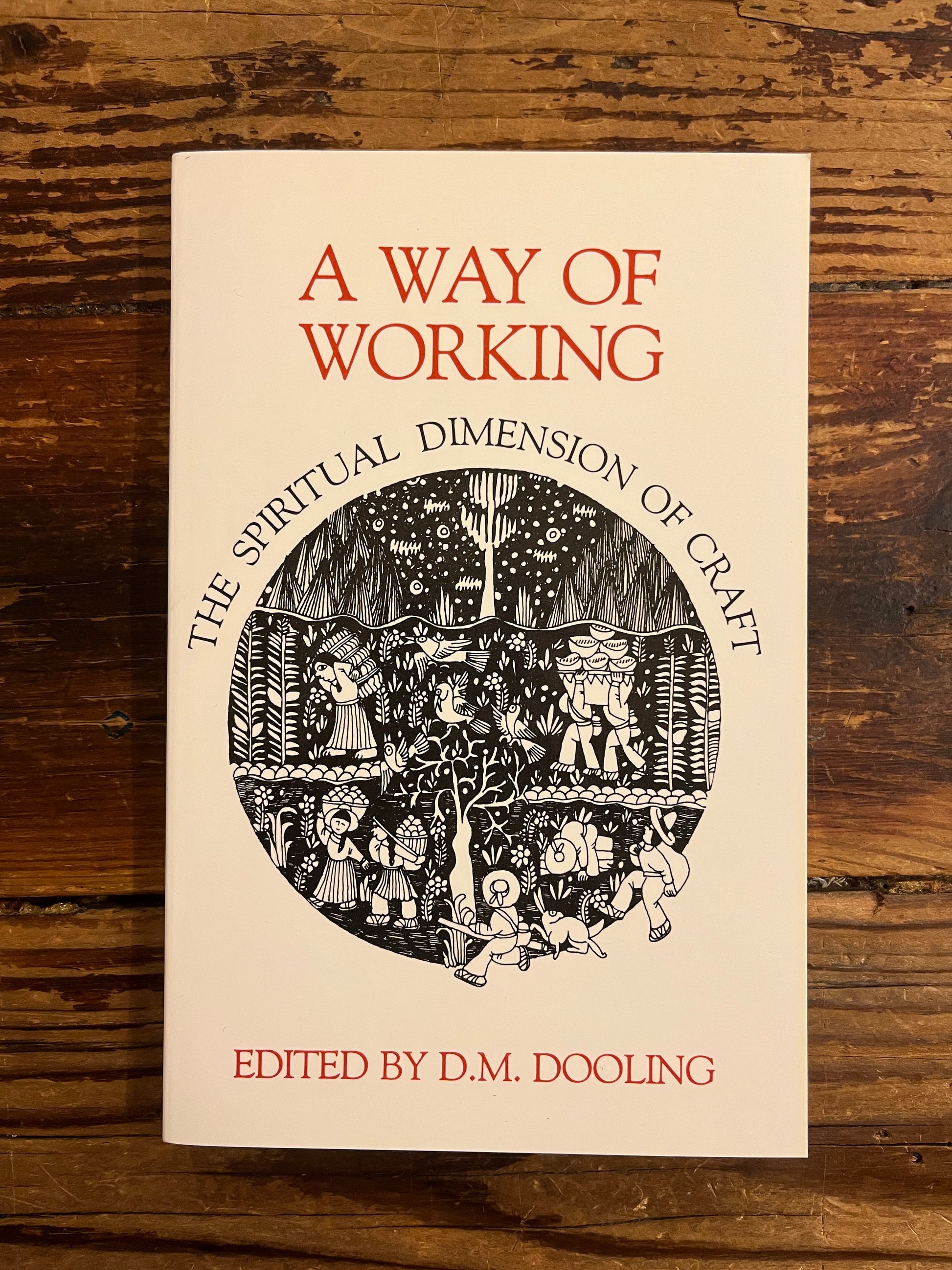 Book cover of 'A Way of Working' on a wooden surface