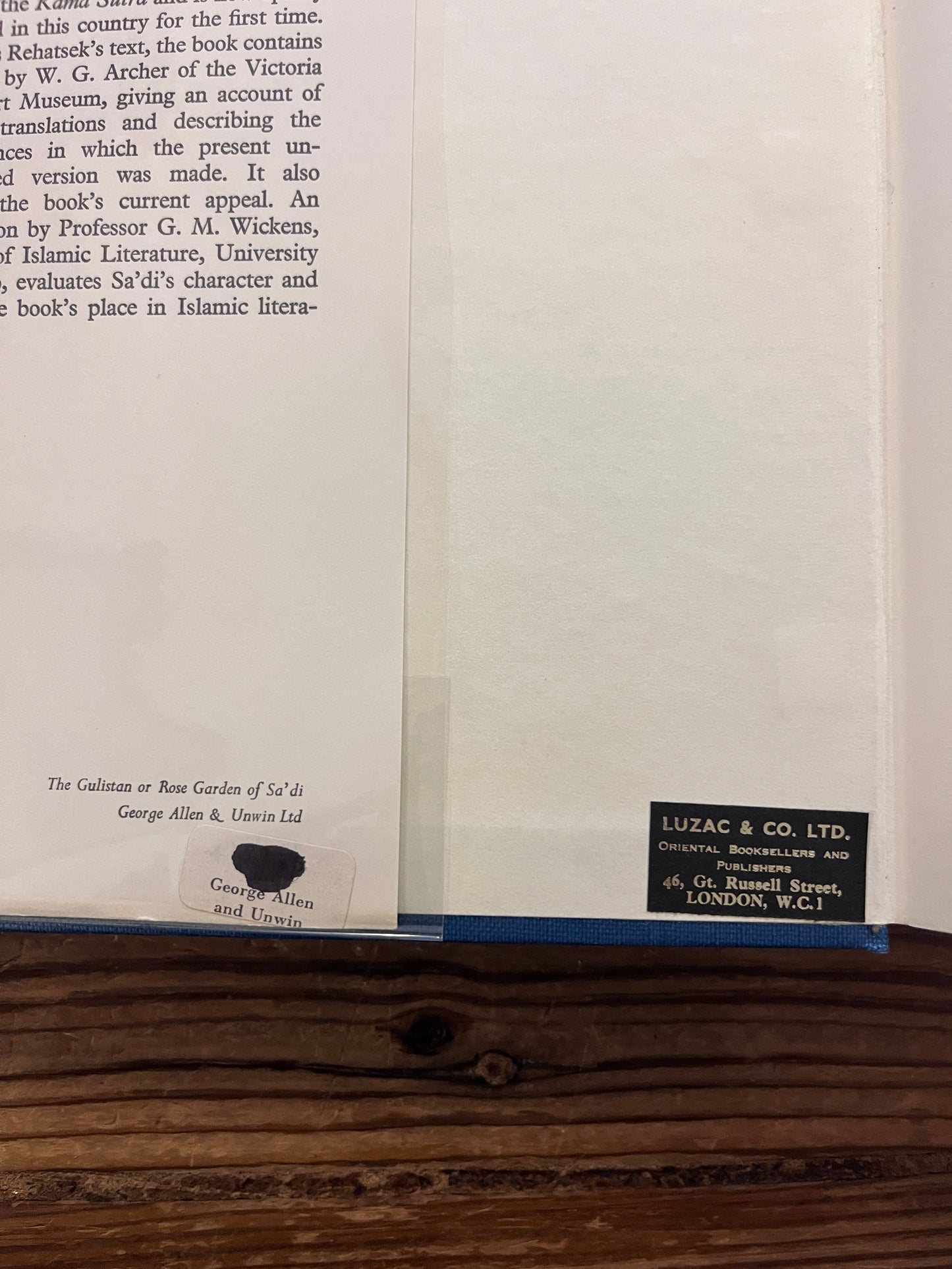 The image shows the two bookstore stickers inside the front cover of a hardcover book titled 'The Gulistan or Rose Garden of Sa'di' with the translator's name, Edward Rehatsek