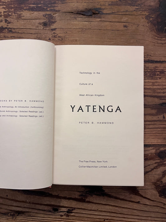 Title page of book titled 'Yatenga' by Peter B. Hammond on a wooden surface 