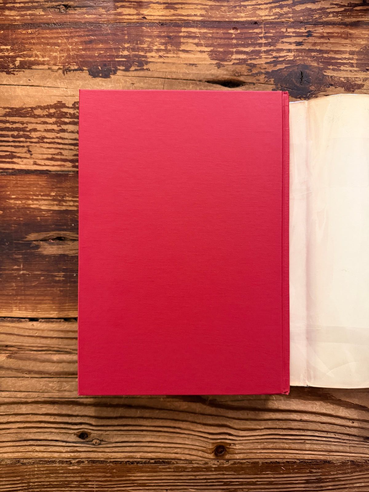 Back cover  without the dust jacket of a book with the title 'Dark Wood to White Rose, journey and transformation in Dante’s Divine Comedy' by Helen M. Luke on a wooden surface 