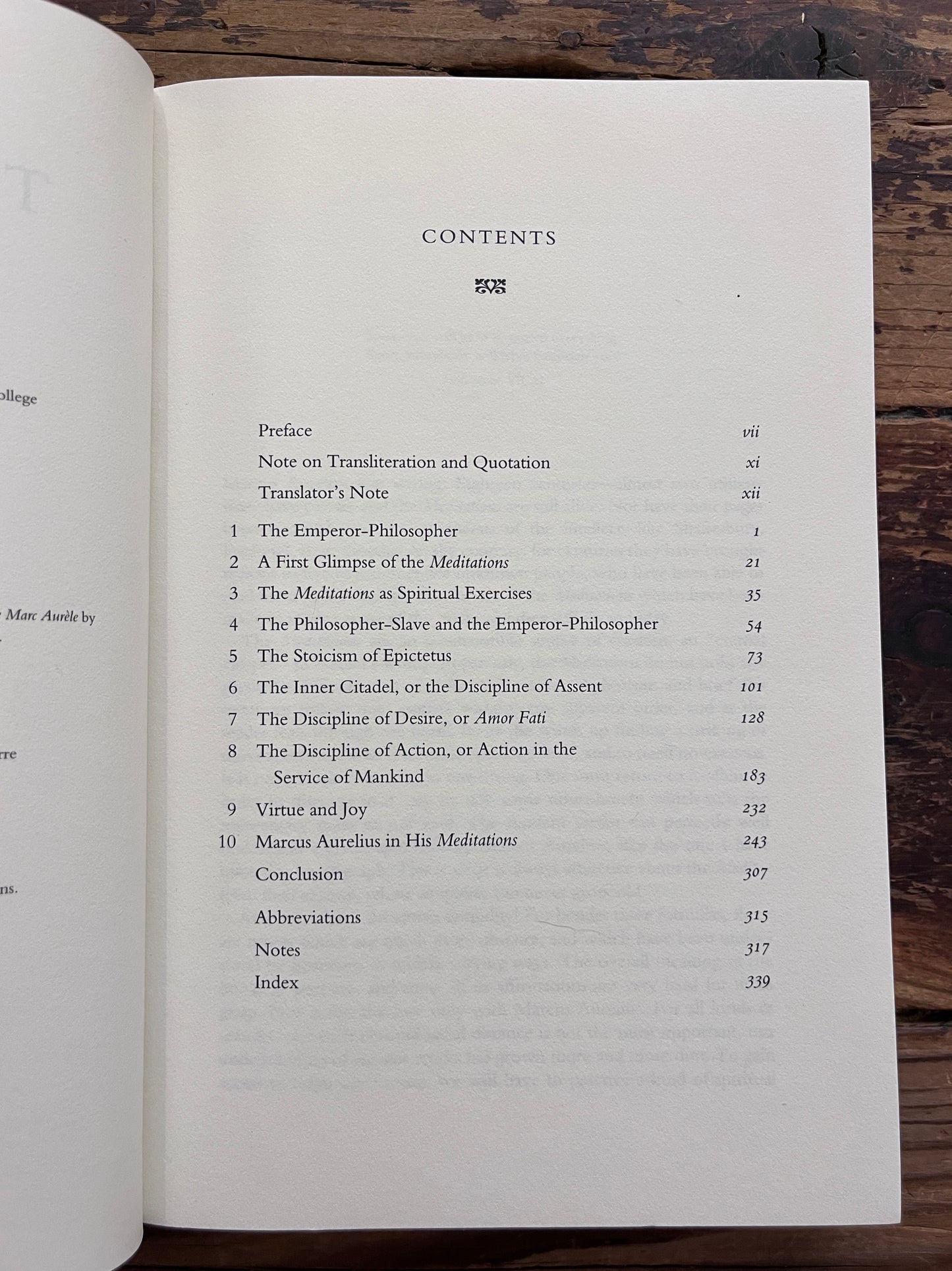 photo of the content table of the book "the innder citadel" on a wooden background