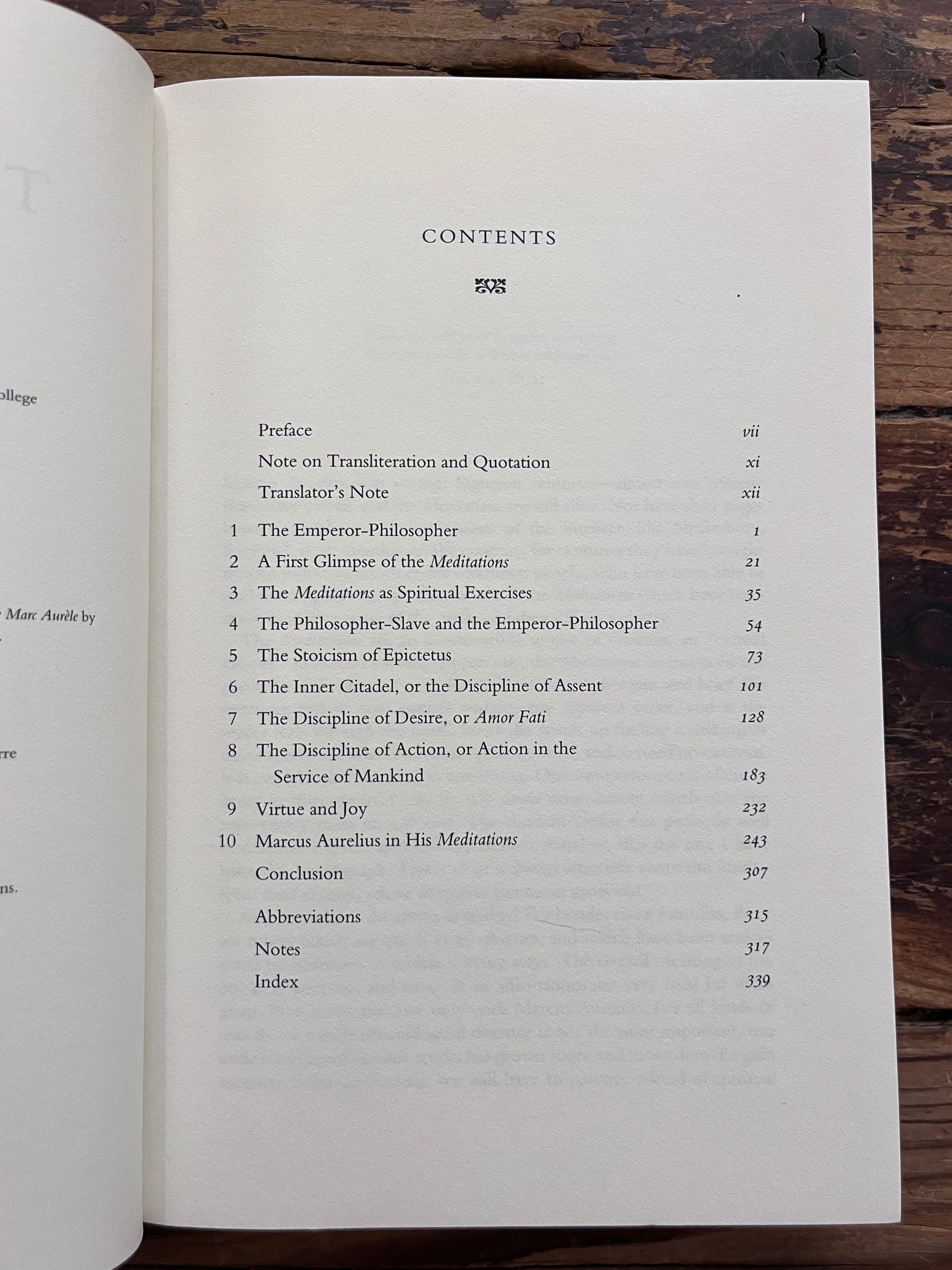 photo of the content table of the book "the innder citadel" on a wooden background