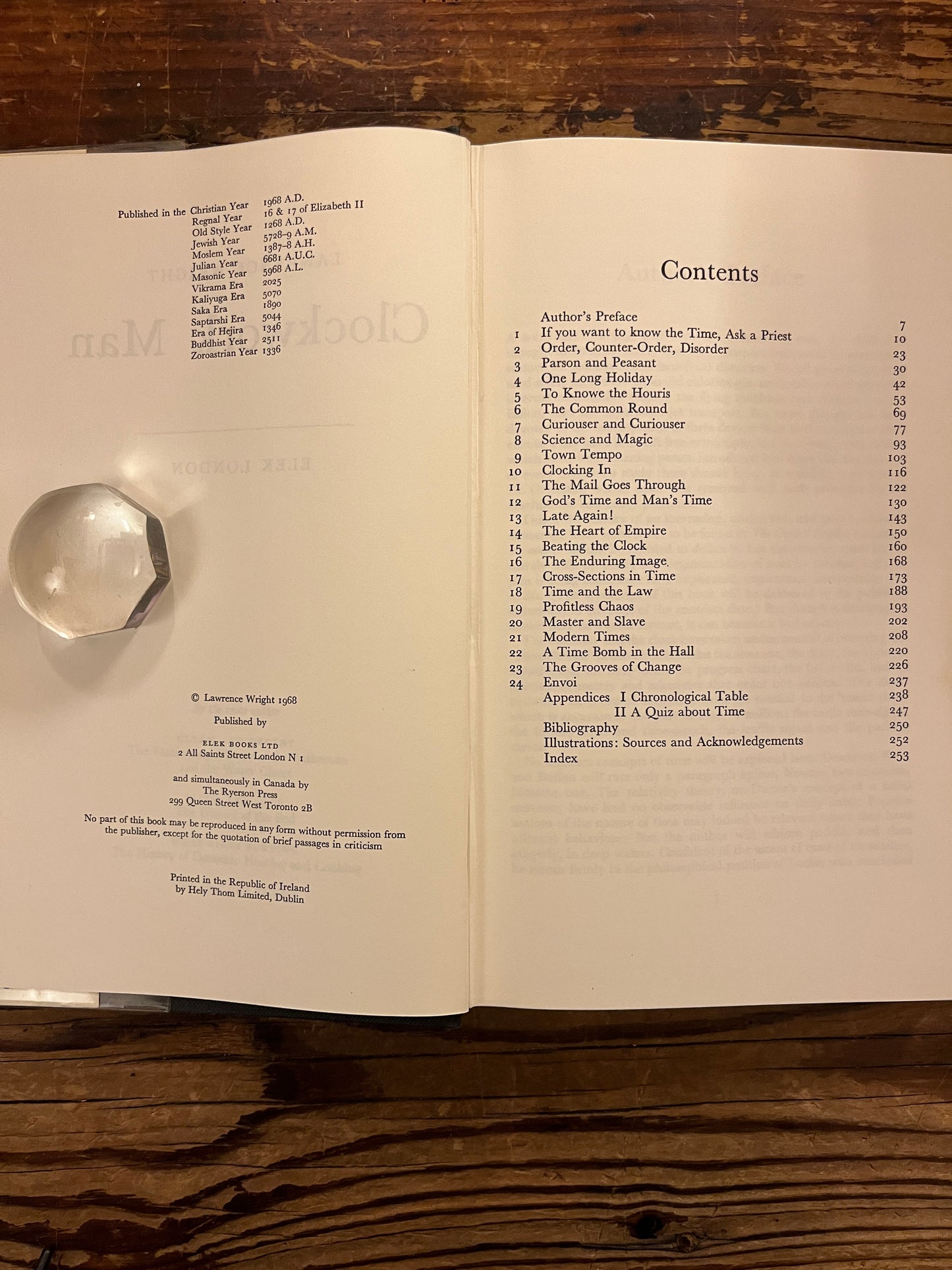 Content of book 'clockwork man' by Lawrence Wright  on a wooden surface 