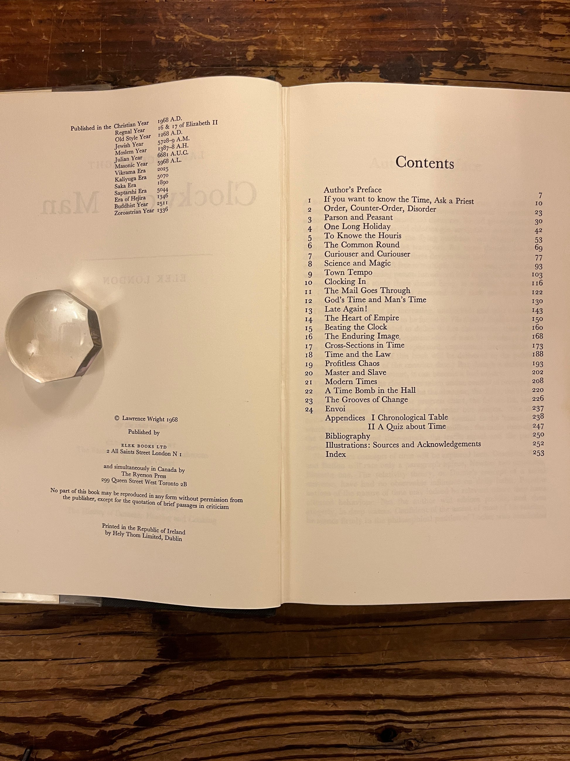 Content of book 'clockwork man' by Lawrence Wright  on a wooden surface 