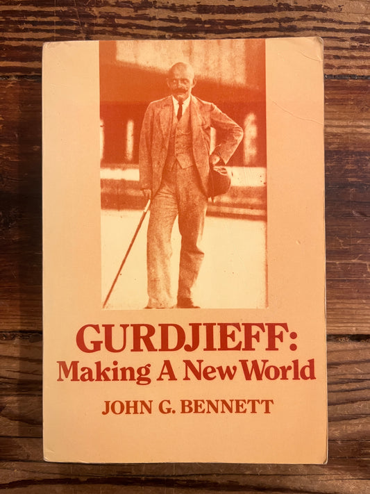 Book titled 'Gurdjieff: Making a New World' by John G. Bennett on a wooden surface.