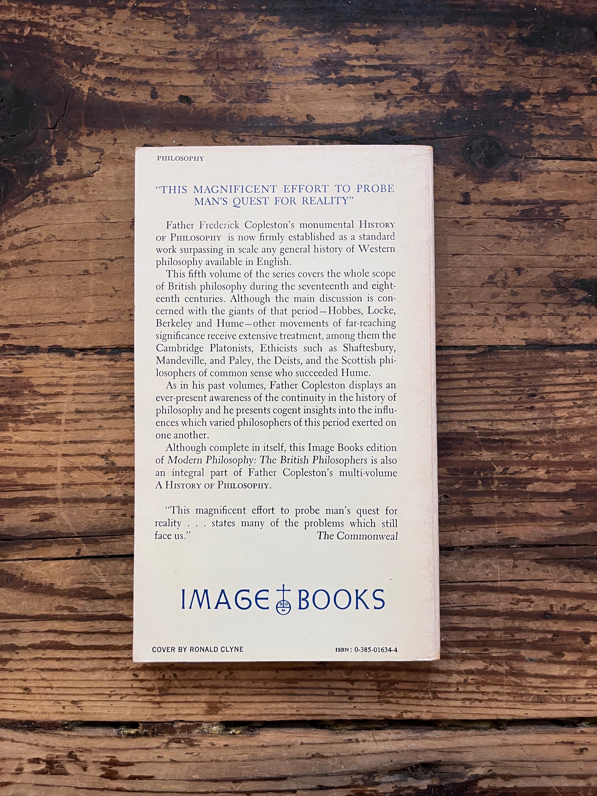 Photo of the cover of the book " a history of philosophy" on a wooden background