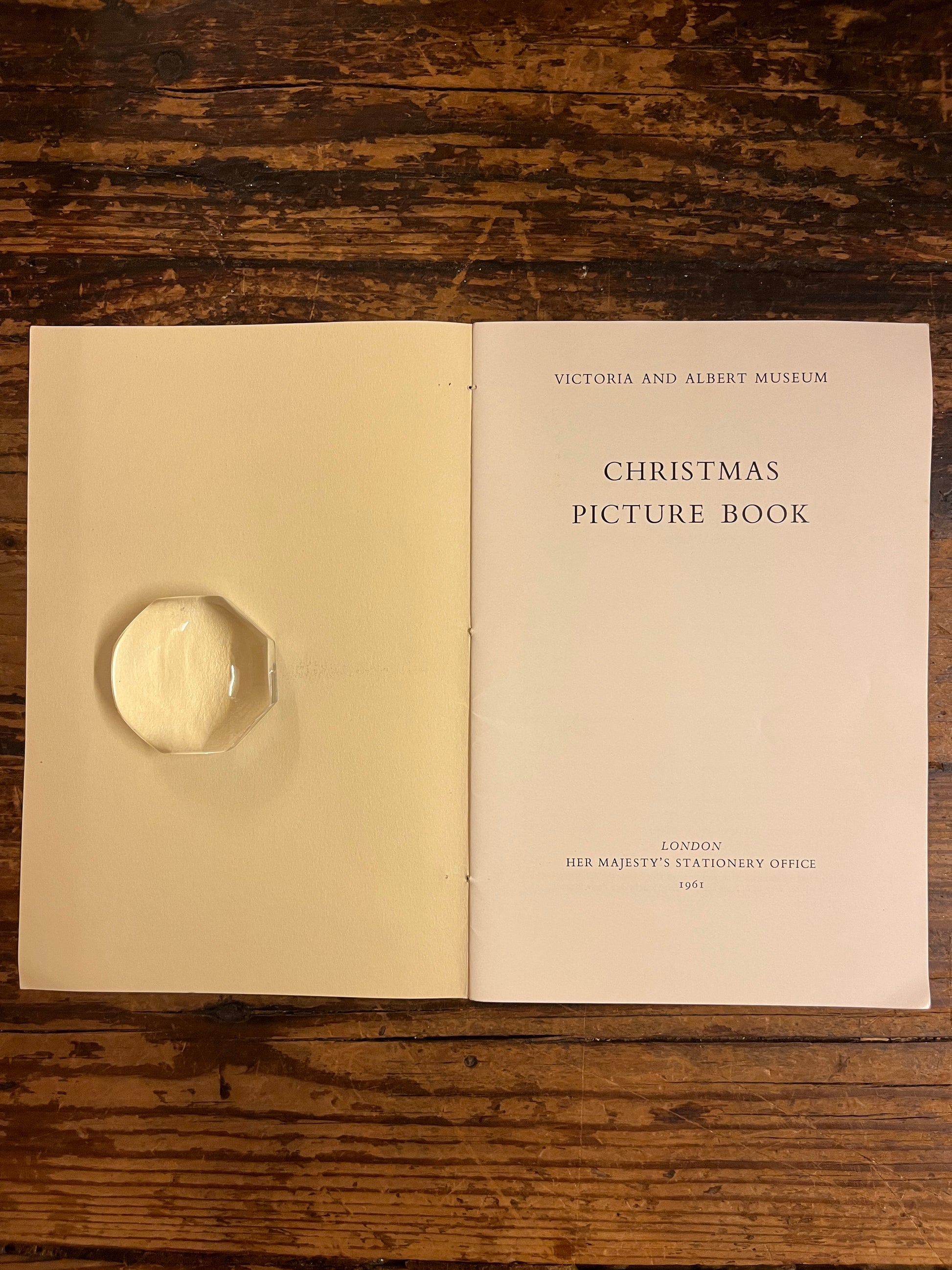 title page of the booklet "Christmas picture book" on a wooden background