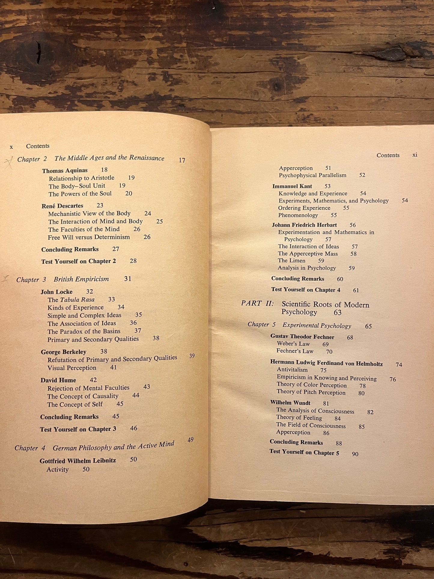 Open book titled 'the story of psychology'  by Frank J. Bruno on a wooden surface 