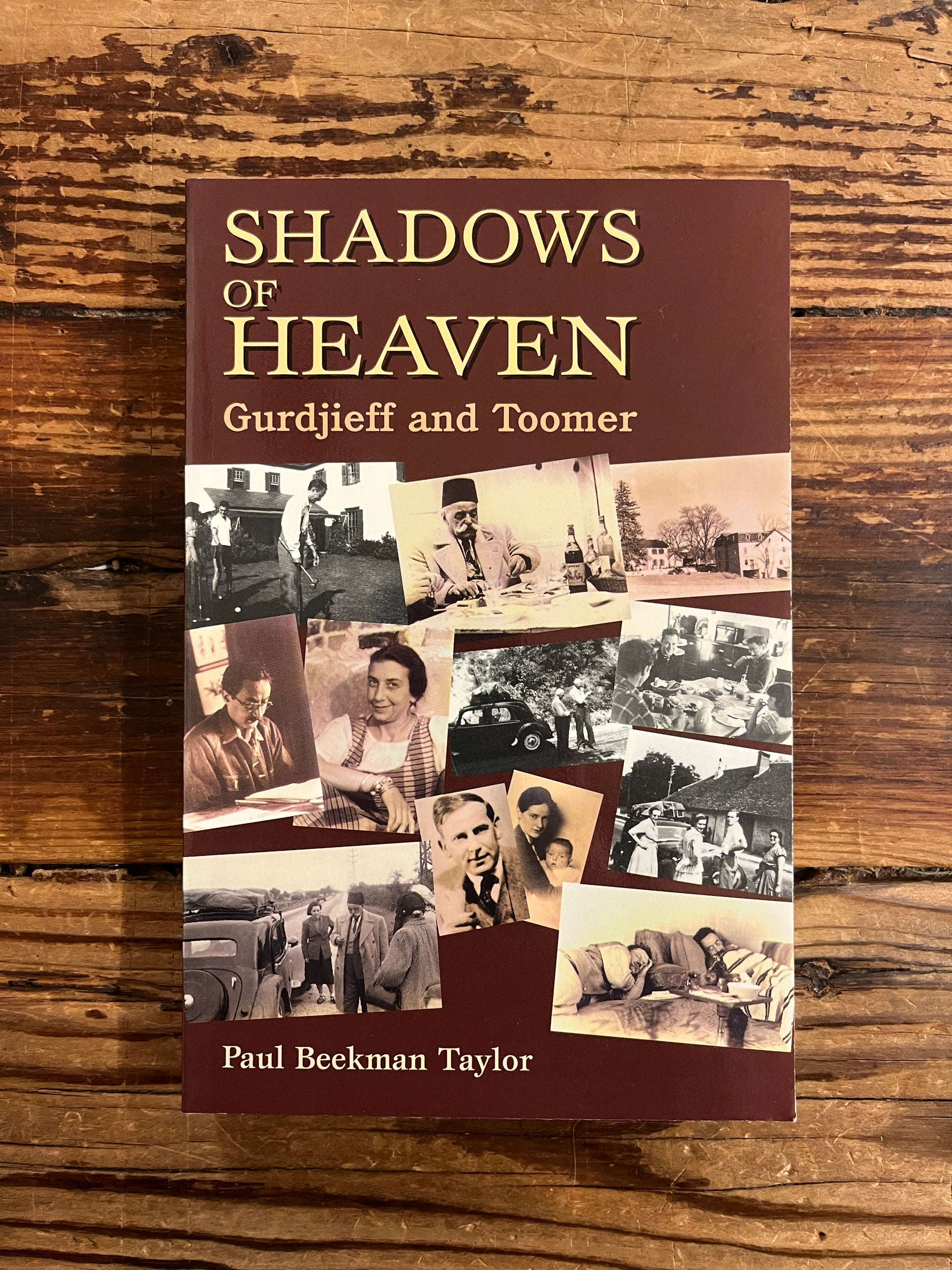 Front cover of book titled 'Shadows of Heaven Gurdjieff and Toomer' by Paul Beekman Taylor on a wooden surface