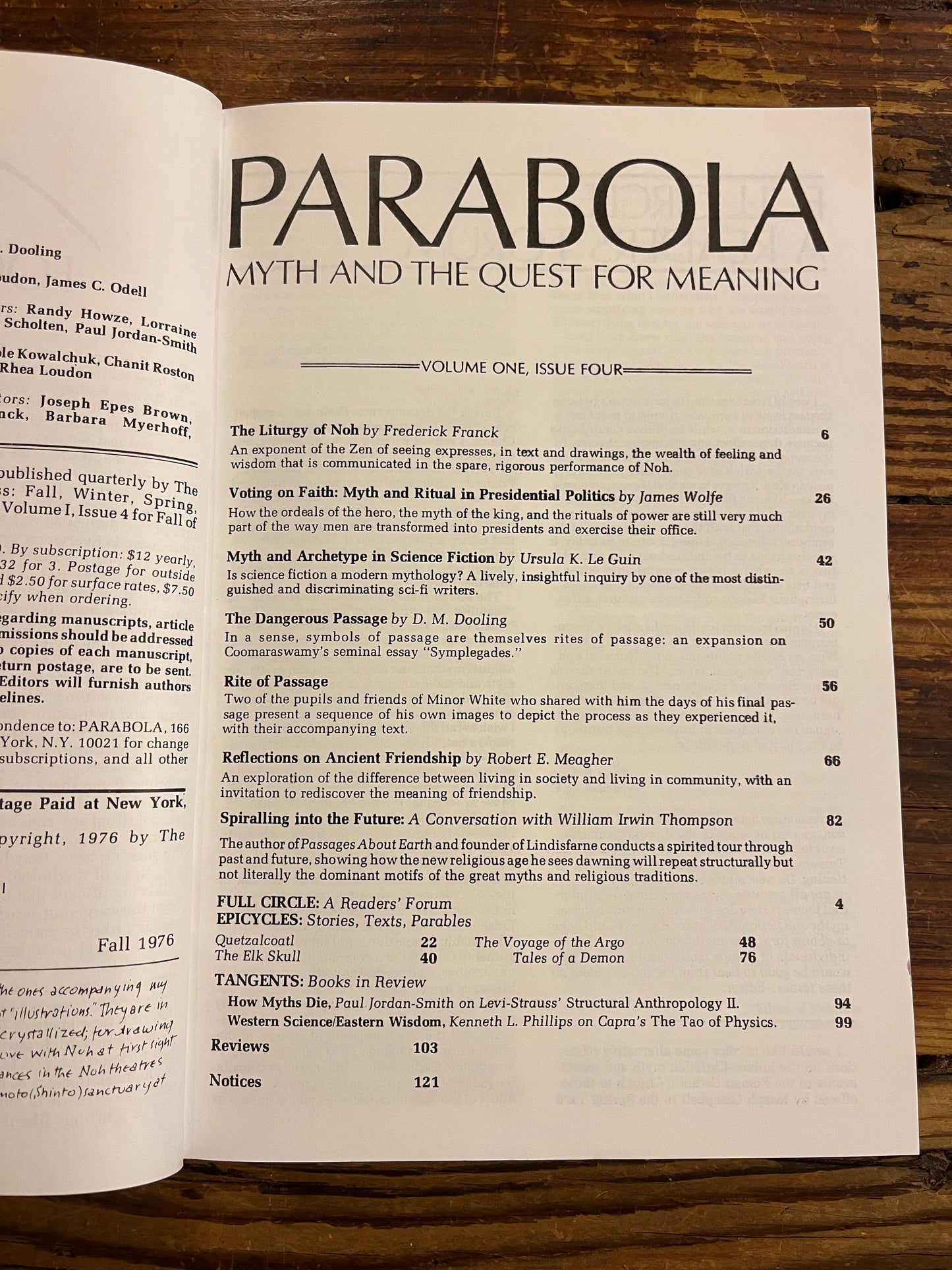 Open magazine titled 'Parabola' showing the contents on a wooden table 