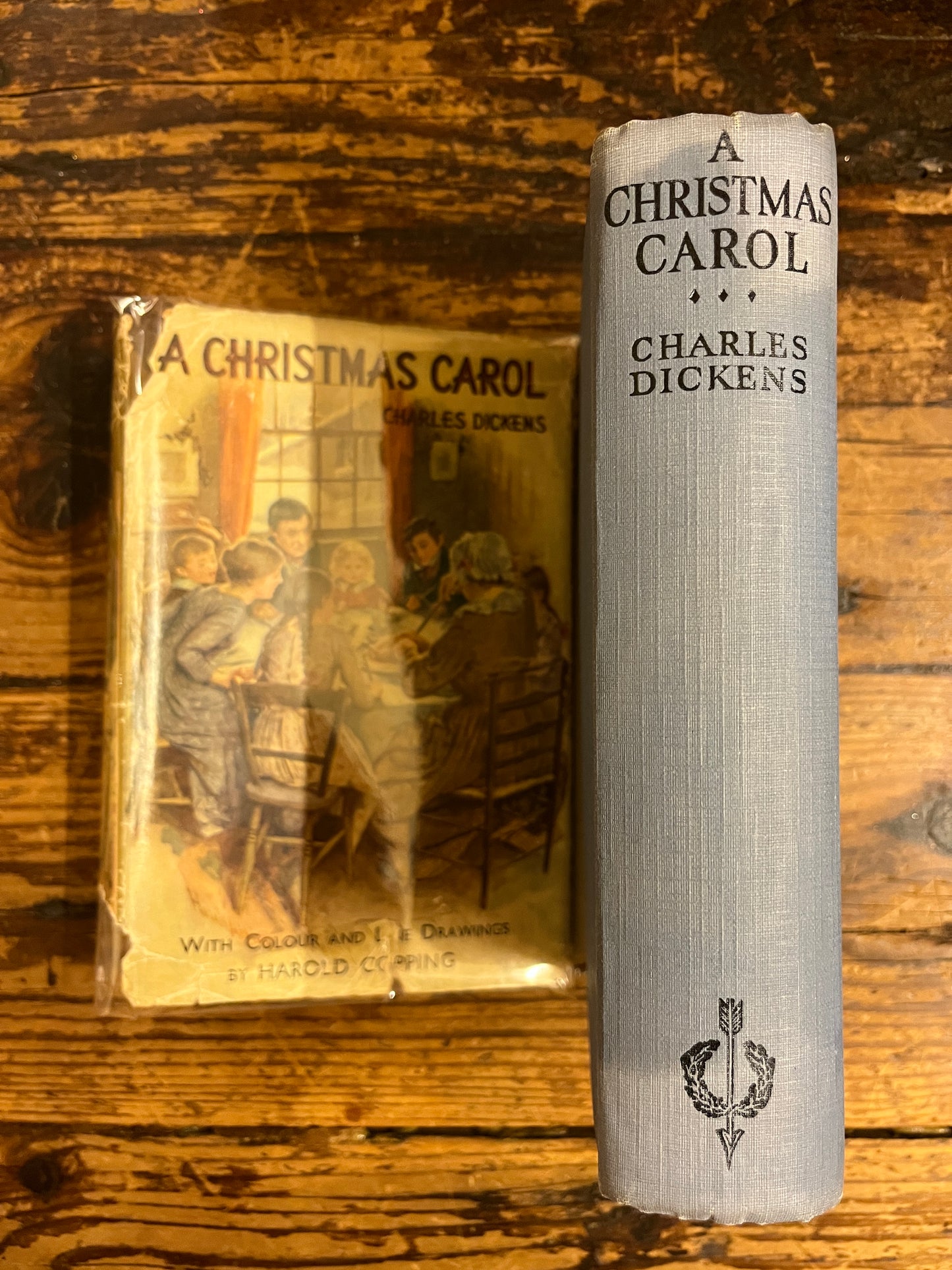 spine from the book "a christmas Carol"  without its dust jacket on a wooden background