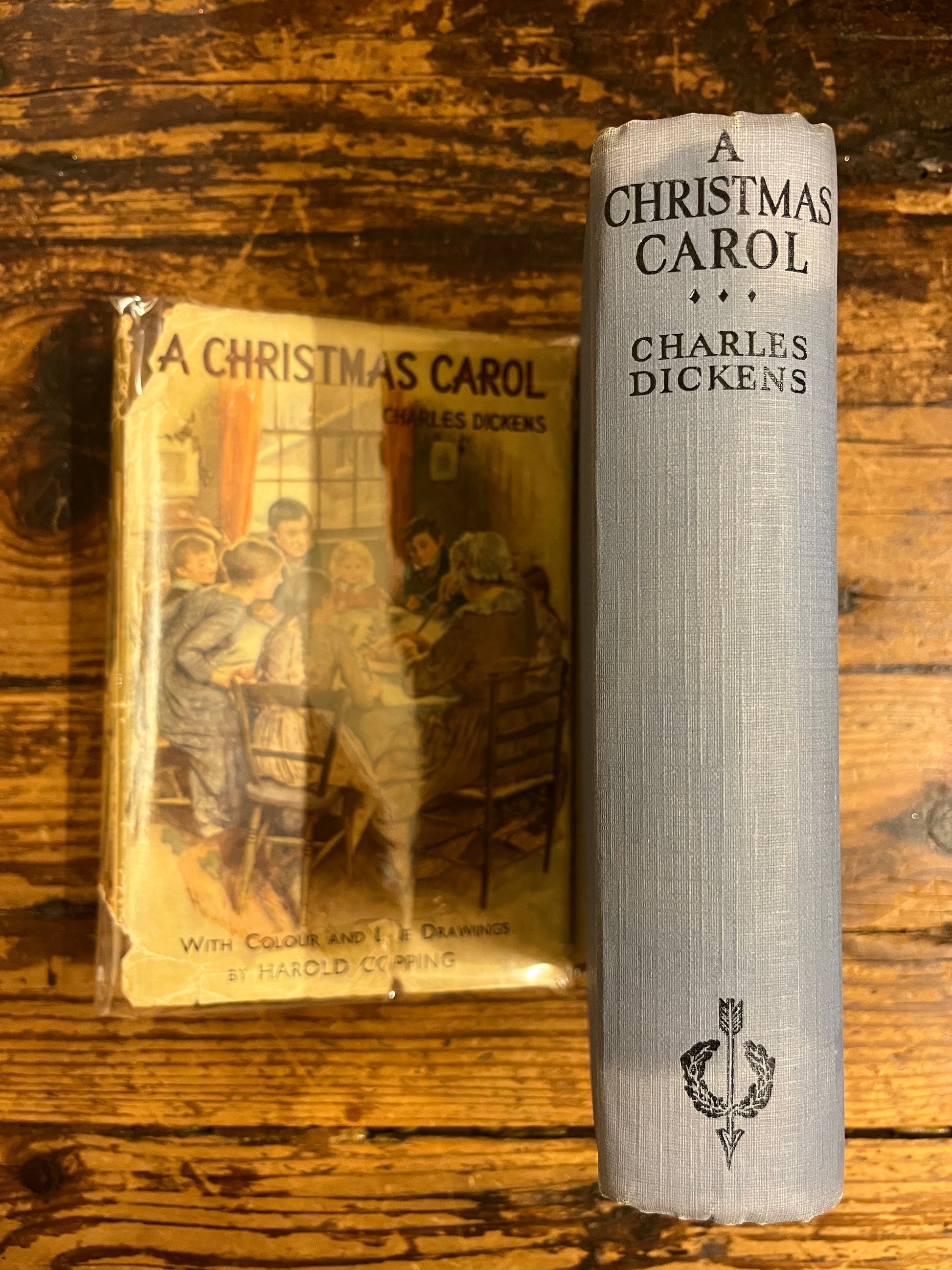 spine from the book "a christmas Carol"  without its dust jacket on a wooden background