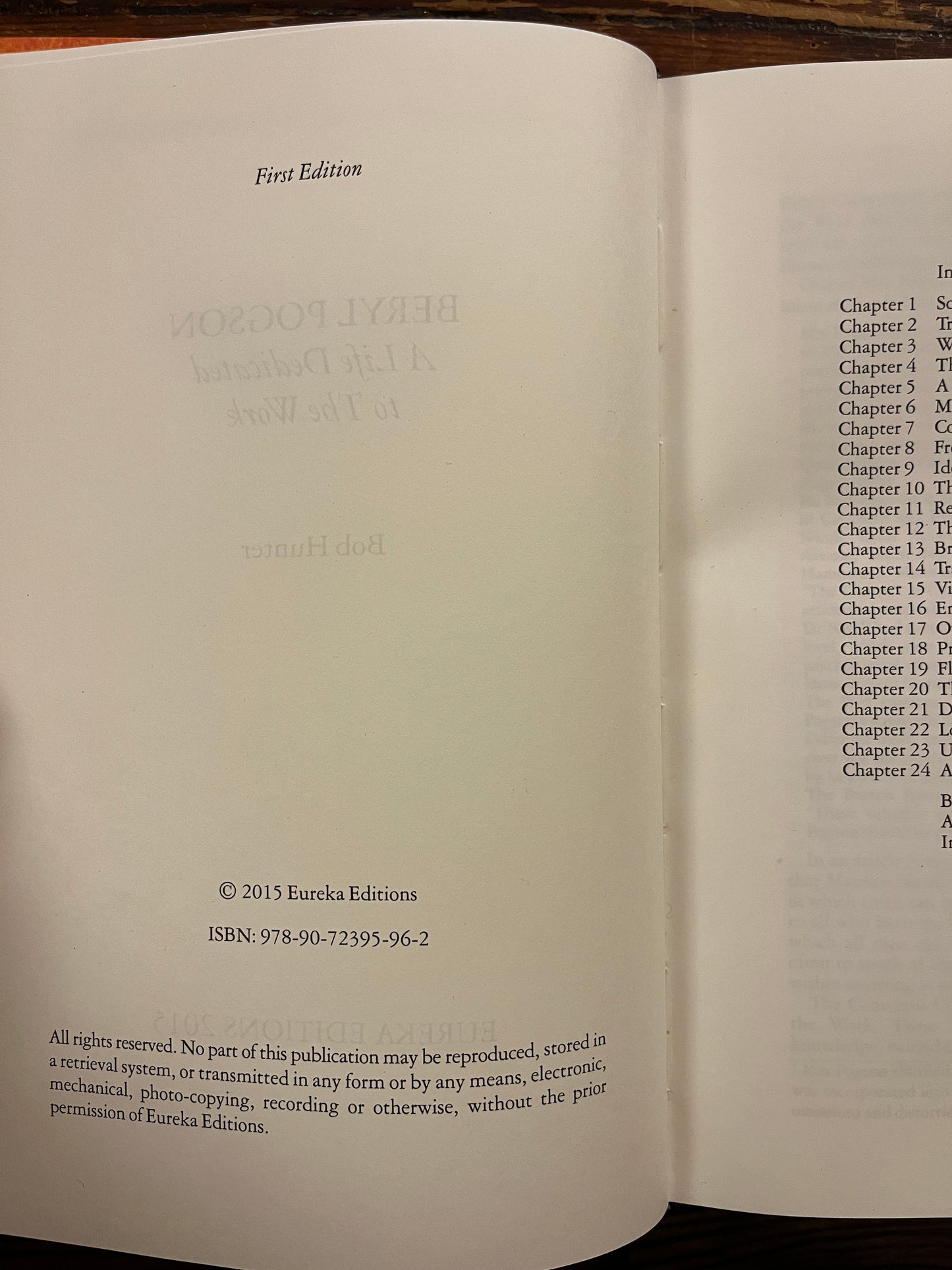 Open book titled 'Beryl Pogson: A Life Dedicated to the Work' by Bob Hunter on a wooden surface