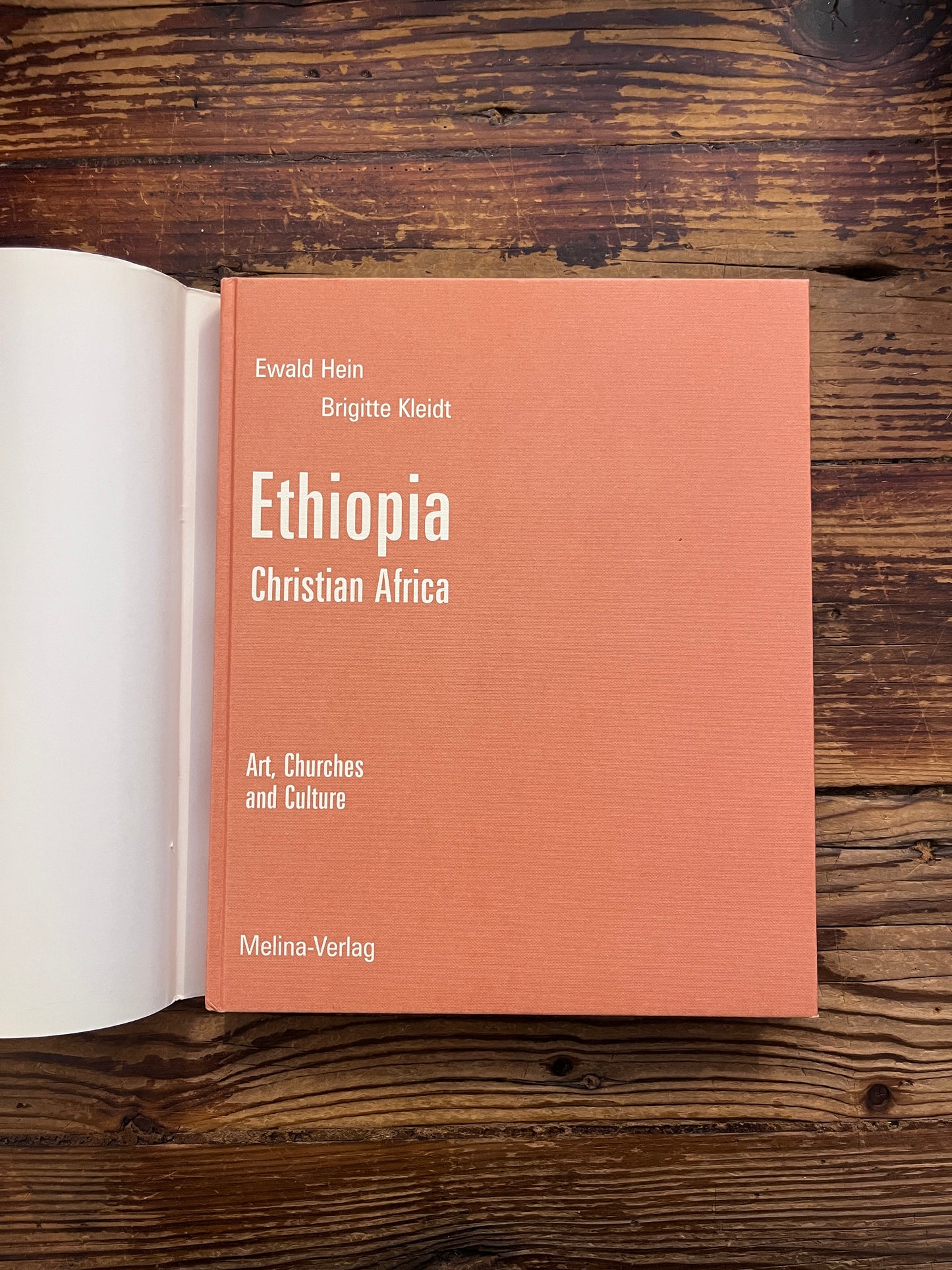 Book titled 'Ethiopia Christian Africa' by Ewald Hein and Brigitte Kleidt on a wooden surface