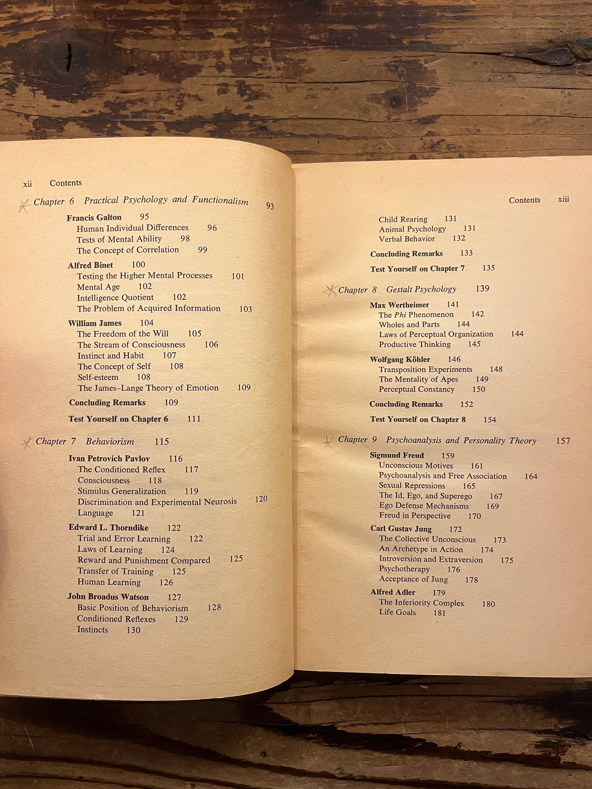 Open book titled 'the story of psychology'  by Frank J. Bruno on a wooden surface 