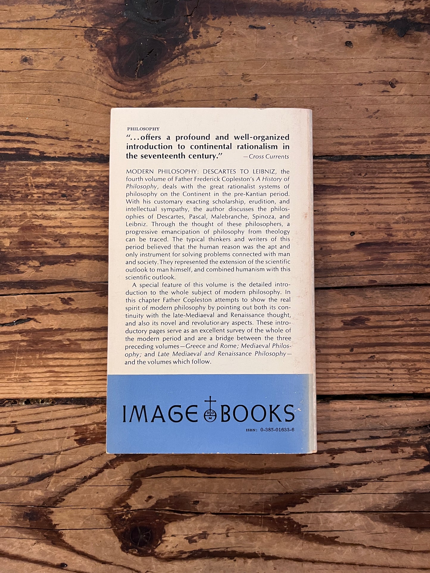 photo of the cover of the book "a history of philosophy" on a wooden background