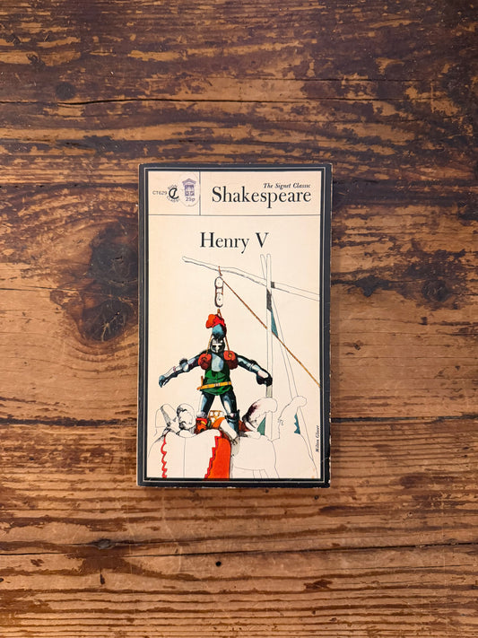 photo of the cover of the book "Henry V" on a wooden background