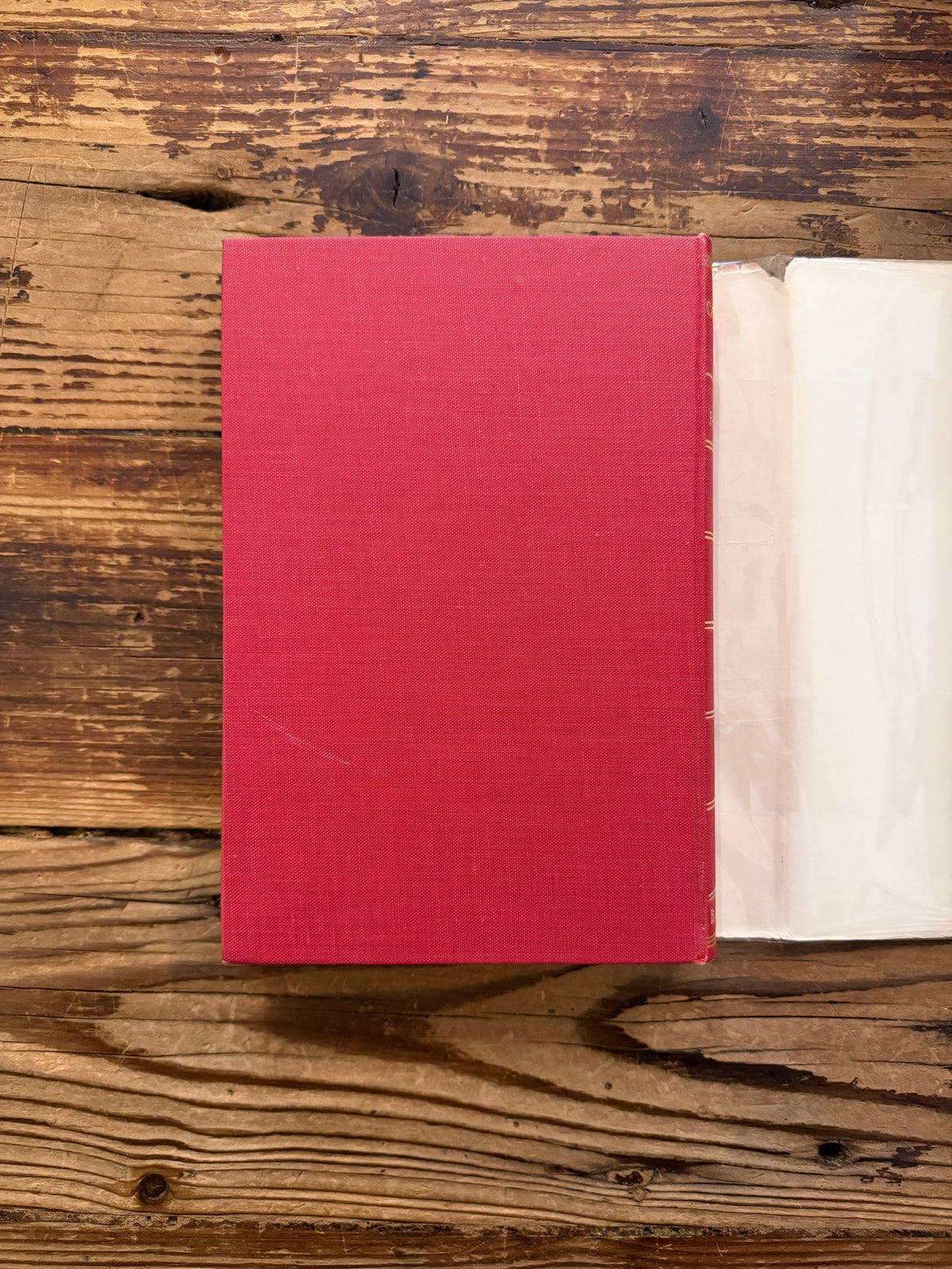 Back cover without dust jacket of a book with the title 'The Cathedrals of Italy' by J.W. Franklin on a wooden surface