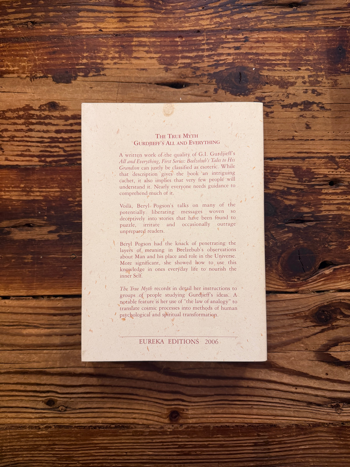 Back cover of book titled 'The True Myth' by Bob Hunter on a wooden surface