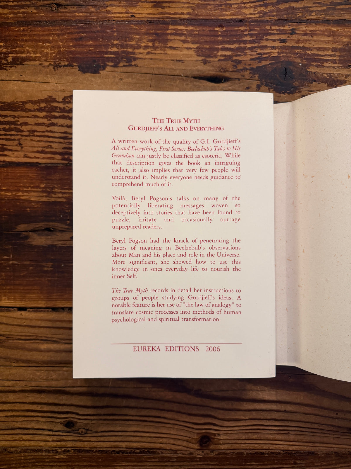 Back cover without dust jacket of book titled 'The True Myth' by Bob Hunter on a wooden surface