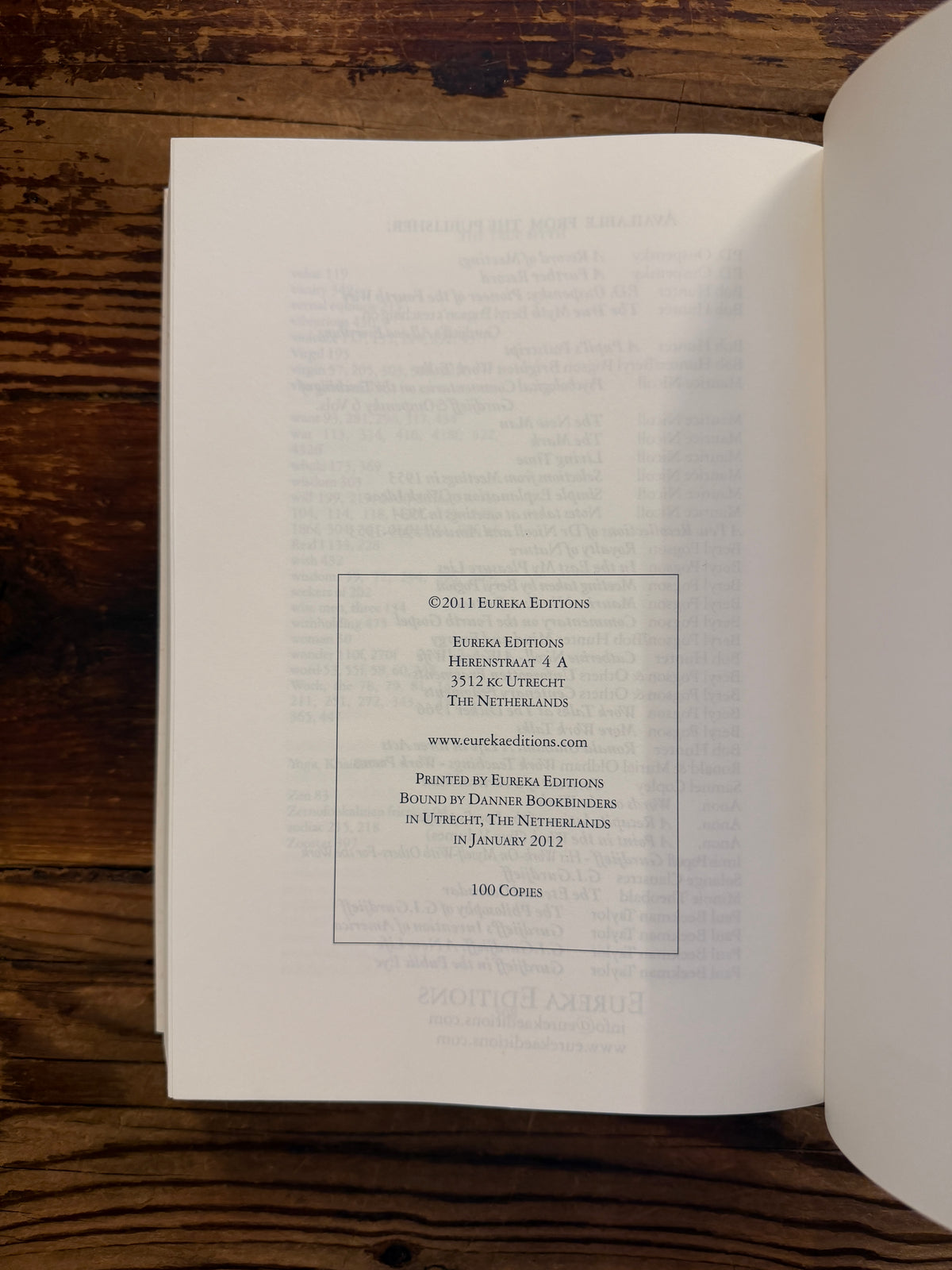 Last page of book titled 'The True Myth' by Bob Hunter on a wooden surface
