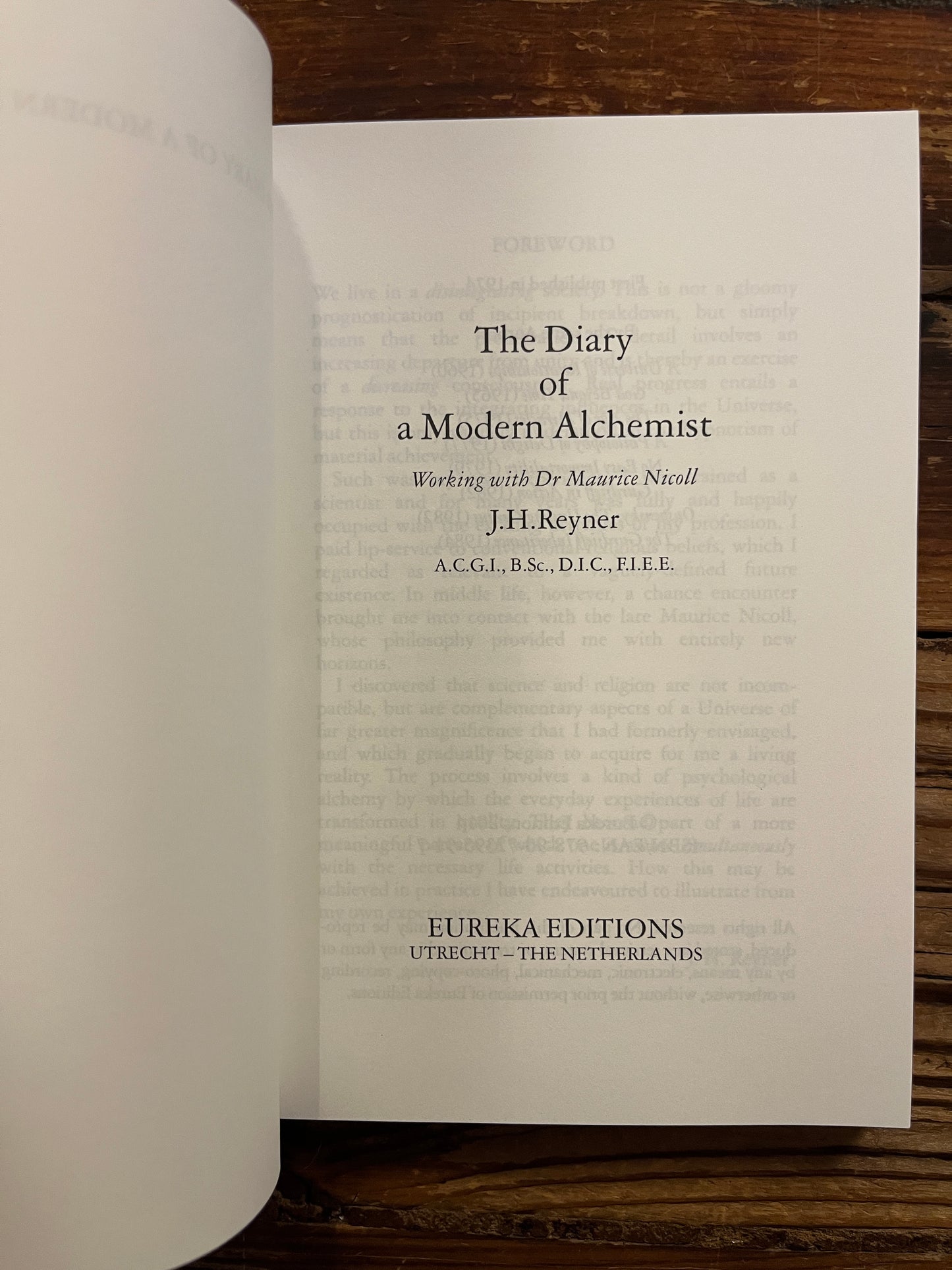 Open book showing the title page, book is titled 'the Diary of a modern Alchemist' by J.H. Reyner 