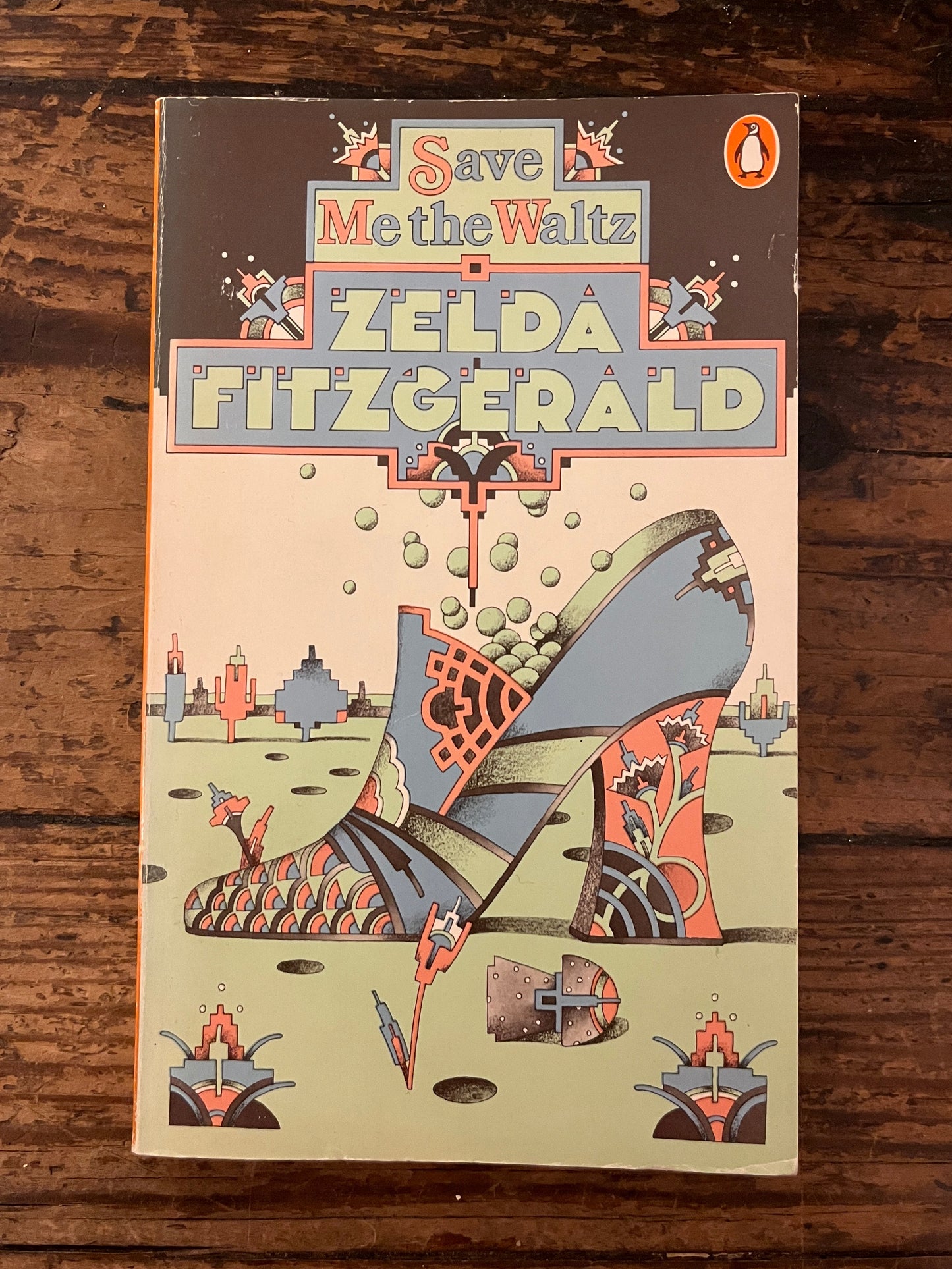 front cover of the book "save me the waltz" on a wooden background