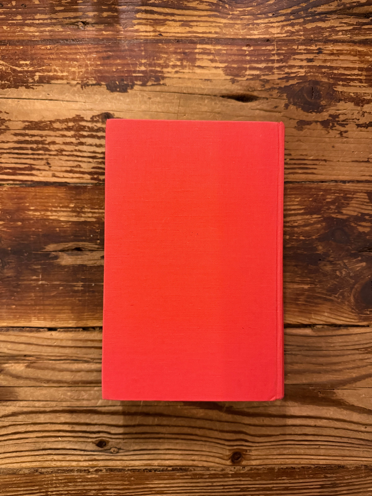 Back cover of book with the titled 'Memories, Dreams, Reflections' by C.G. Jung, 1st English Edition 1963, on a wooden surface 