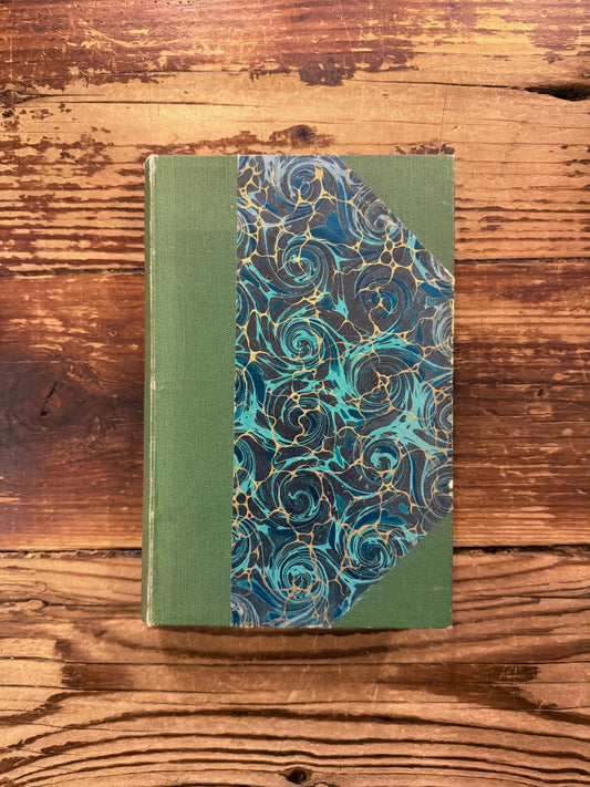 Voorkant van boek met de titel 'Nederlands Dichters' samengesteld door  D. Ouwersloot, G. Portielje & Zoon editie uit 1856, op een houten achtergrond