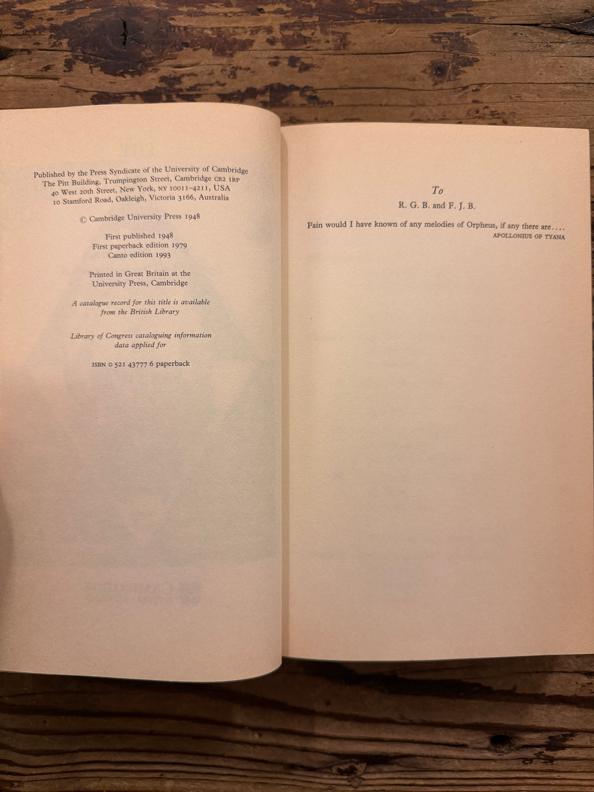 Open book with the title 'The Myth of the Magnus' by E.M. Butler lying on a wooden surface